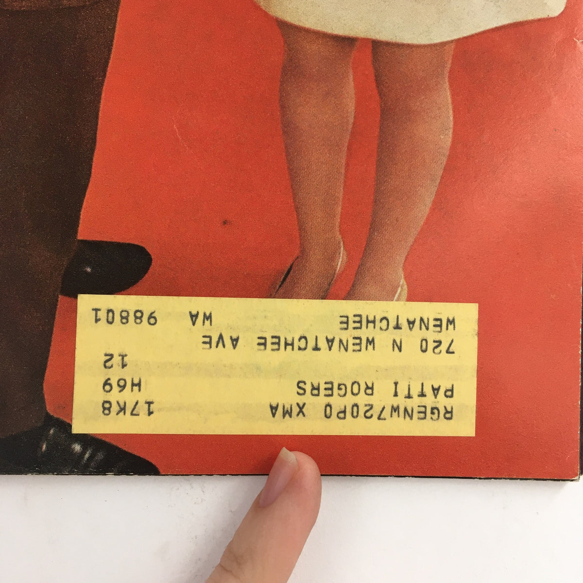 Close-up view of the cover of American Girl Magazine December 1968, highlighting the magazine details and a couple dressed in 1960s fashion.