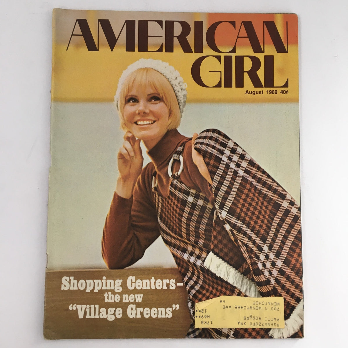 Cover of American Girl Magazine August 1969 titled 'Shopping Centers Are The New "Village Greens"' featuring a smiling young woman with a stylish hat and a patterned bag, reflecting 1960s fashion.