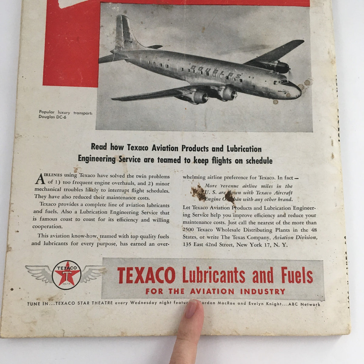 Rear cover of the Aero Digest August 1948 magazine featuring an advertisement for Texaco Aviation Products and Lubrication Services, with a Douglas DC-6 airplane illustration.