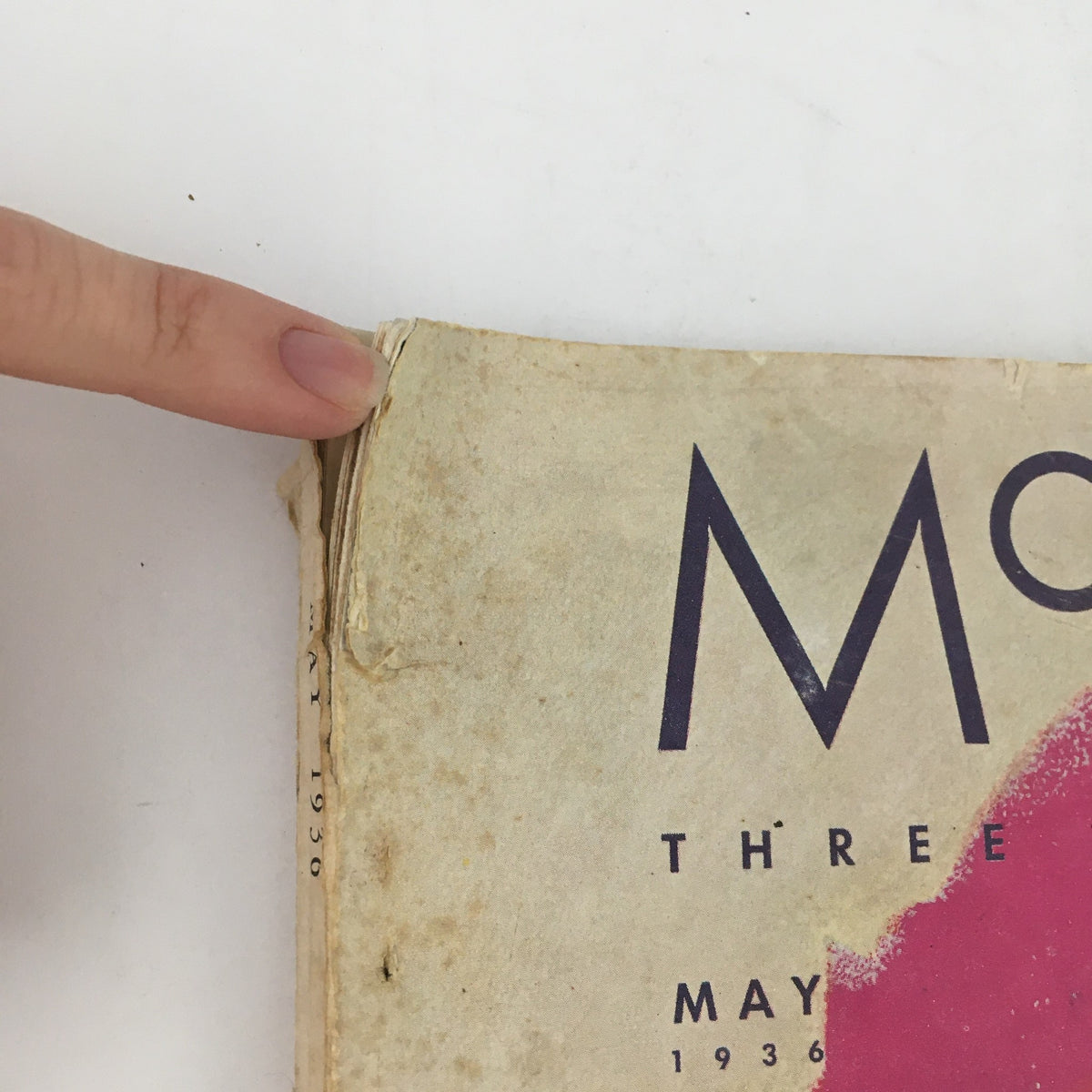 Side view of McCall's Magazine May 1936 showing the month and year, along with vintage magazine features.