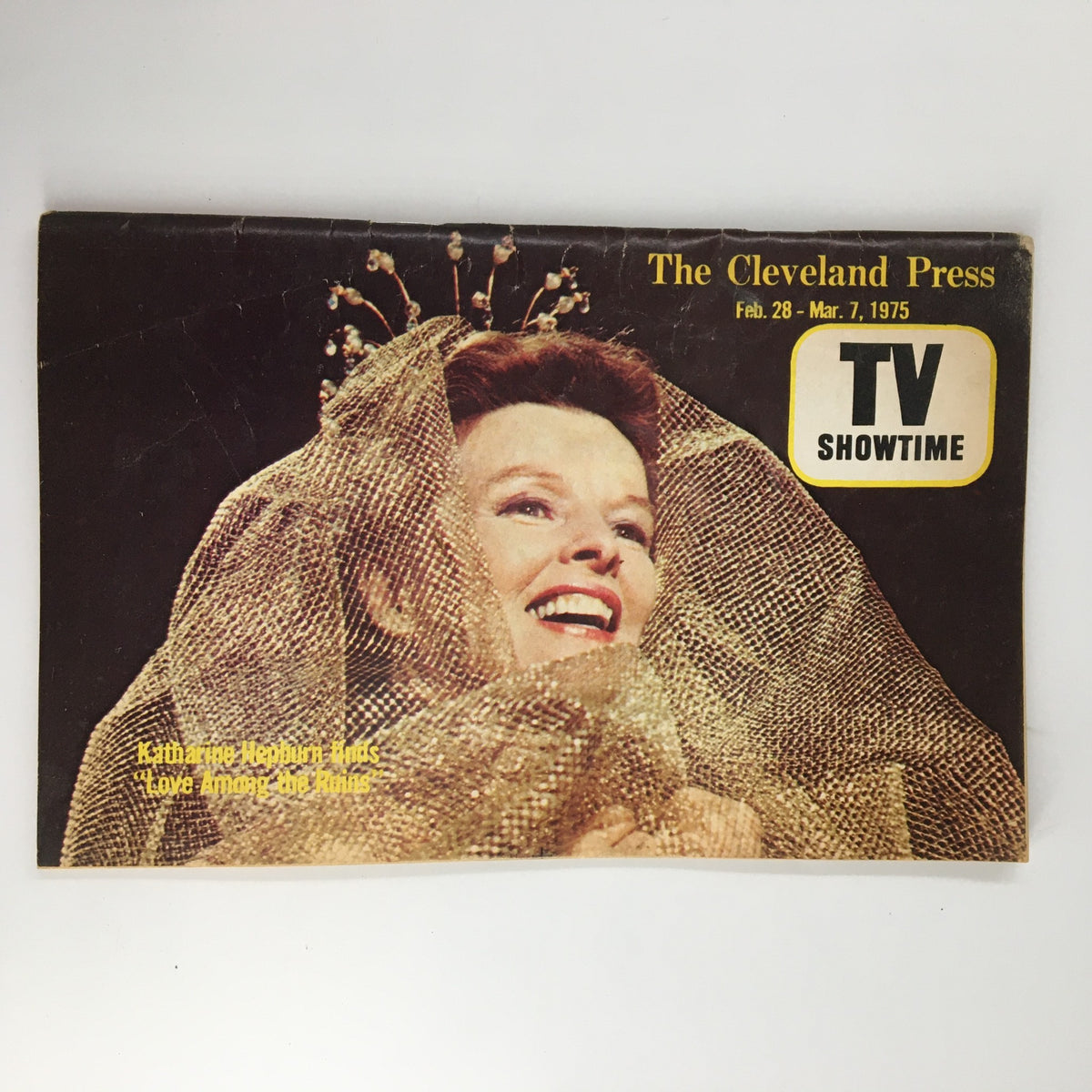 The Cleveland Press TV Showtime Guide February 28 1975 featuring Katharine Hepburn on the cover, showcasing her smiling face adorned with a gold veil, representing vintage magazine charm from the 1970s.