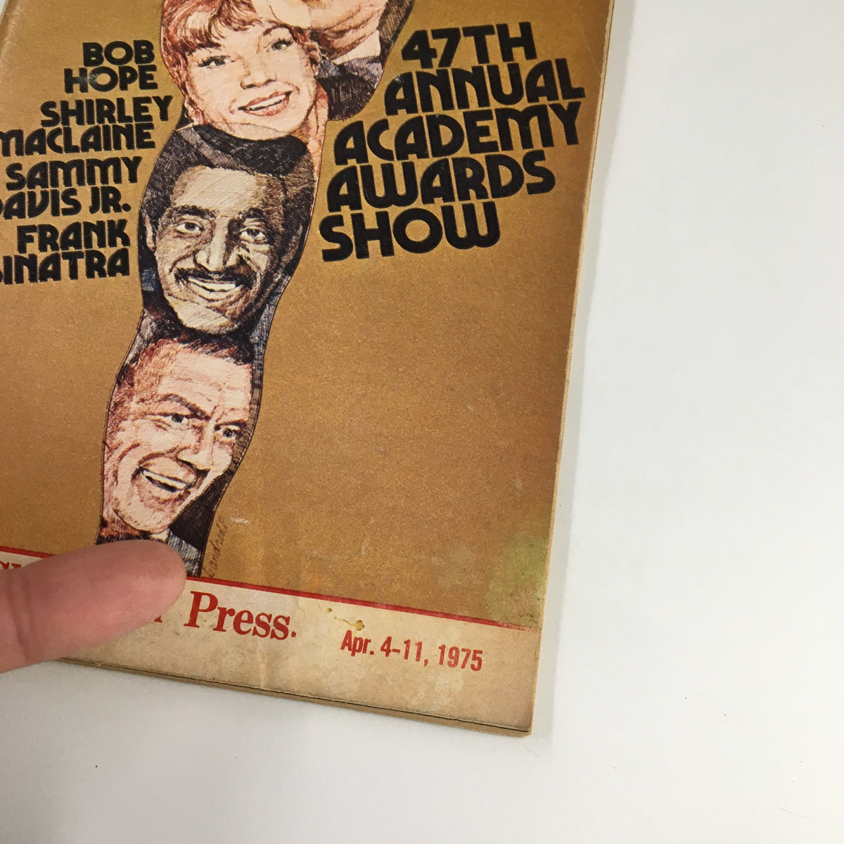 Close-up of The Cleveland Press TV Showtime Guide from April 4, 1975, highlighting the iconic figures Bob Hope, Shirley MacLaine, Sammy Davis Jr., and Frank Sinatra, related to the 47th Annual Academy Awards.