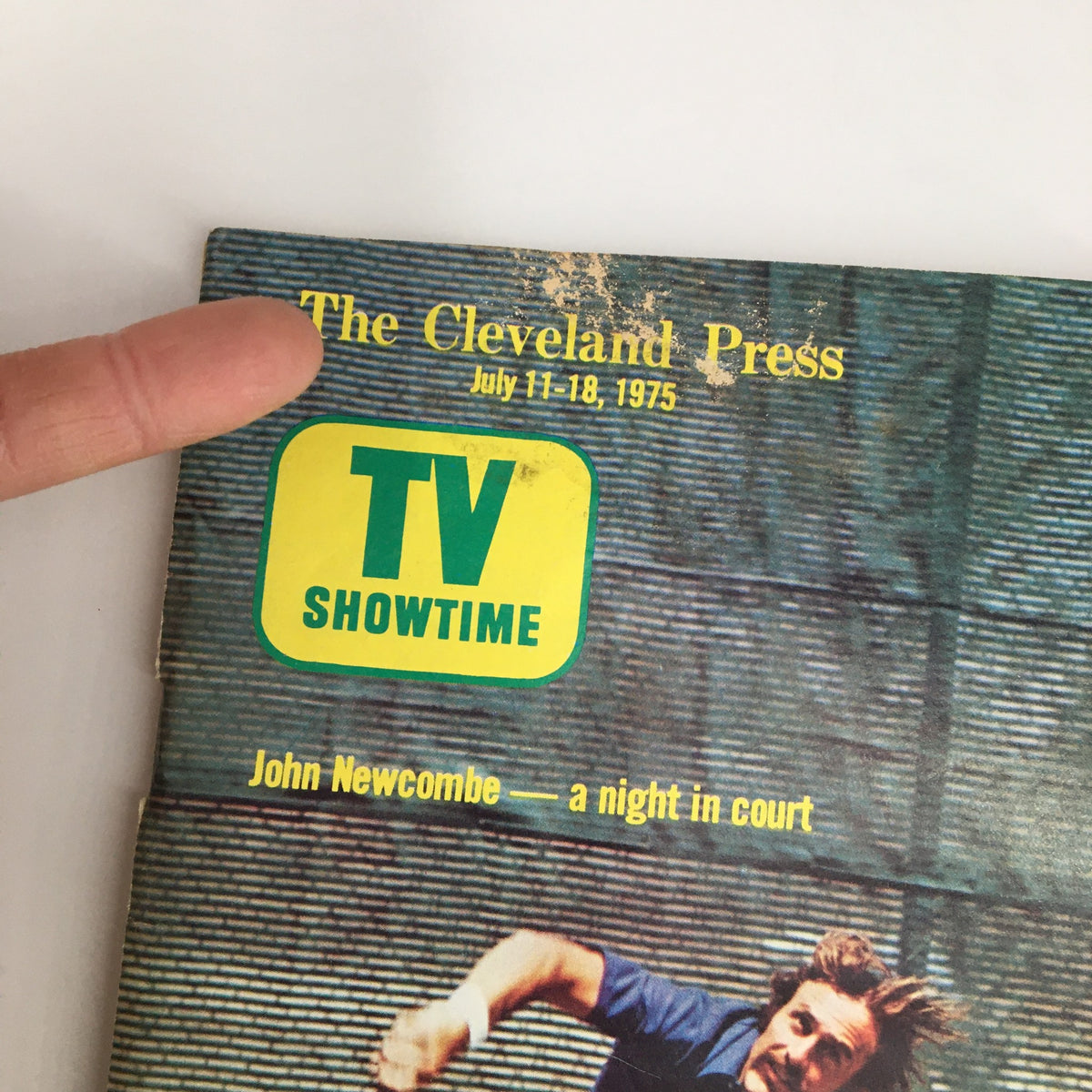 Close-up of The Cleveland Press TV Showtime Guide cover dated July 11-18, 1975, highlighting the title and John Newcombe's featured article.
