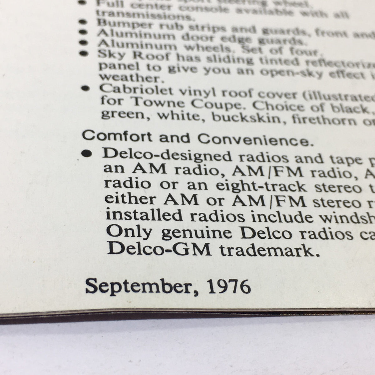Close-up of the September 1976 Chevrolet Monza brochure detailing comfort and convenience features.