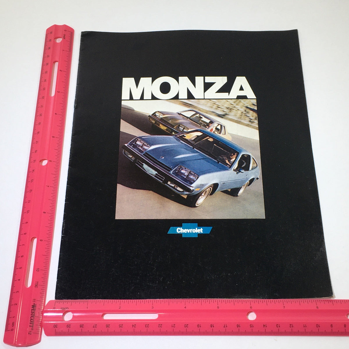 Cover of the September 1976 Chevrolet Monza brochure featuring vibrant visuals of the Monza model.
