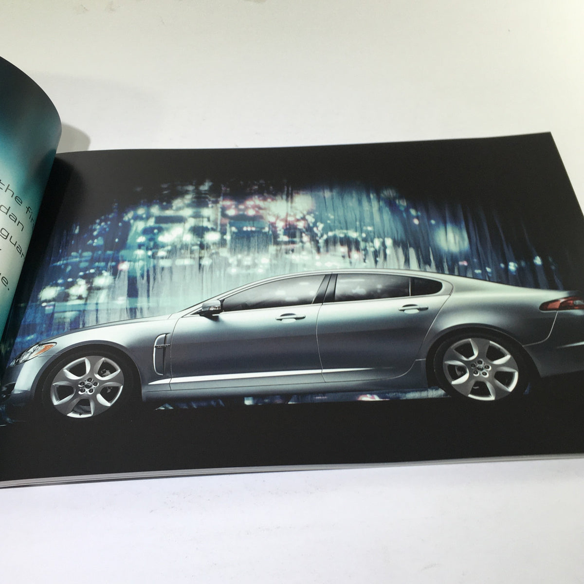 2009 Jaguar XF Dealership Car Auto Brochure Catalog showcasing an interior image of the Jaguar XF in a modern cityscape.