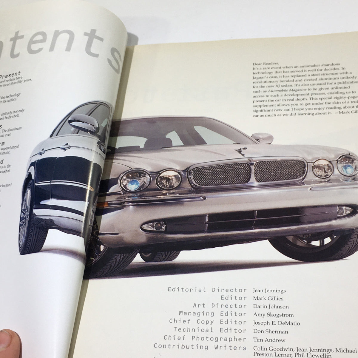 Inside page of the 2000 Jaguar Automobile Magazine Dealership Car Auto Brochure Catalog displaying the contents page with a Jaguar vehicle featured prominently.
