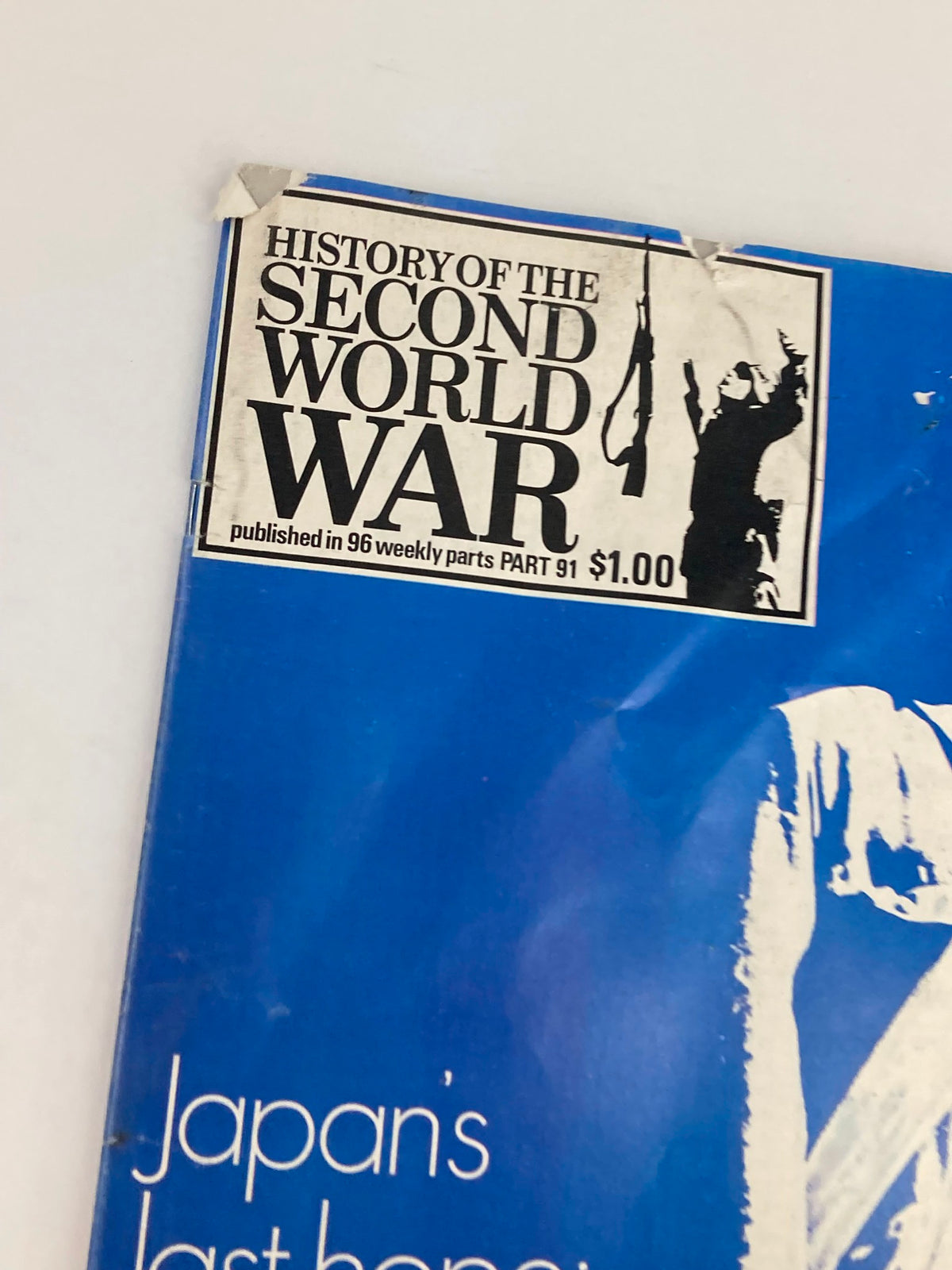 Close-up of the label on the cover of VTG History of the Second World War Part 91, 1975, displaying the text 'History of the Second World War' with pricing of $1.00 and indicating it is published in 96 weekly parts.