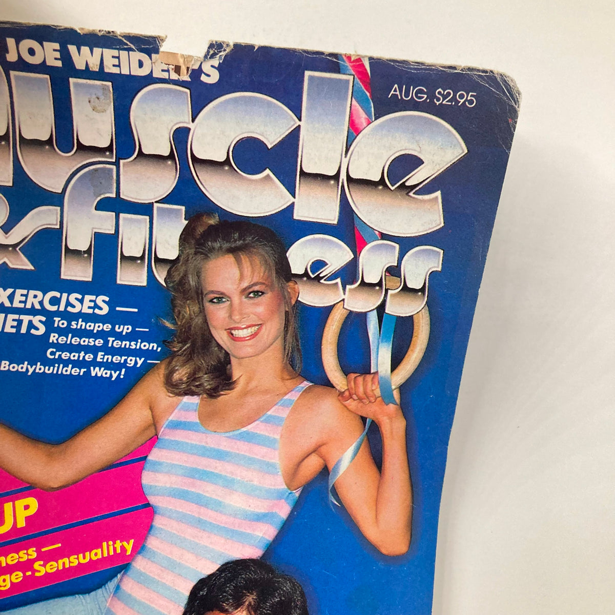 Cover of Muscle & Fitness Magazine August 1982 featuring Ray Mentzer and Christie Welsh smiling while holding gym rings, showcasing vintage fitness fashion and culture.