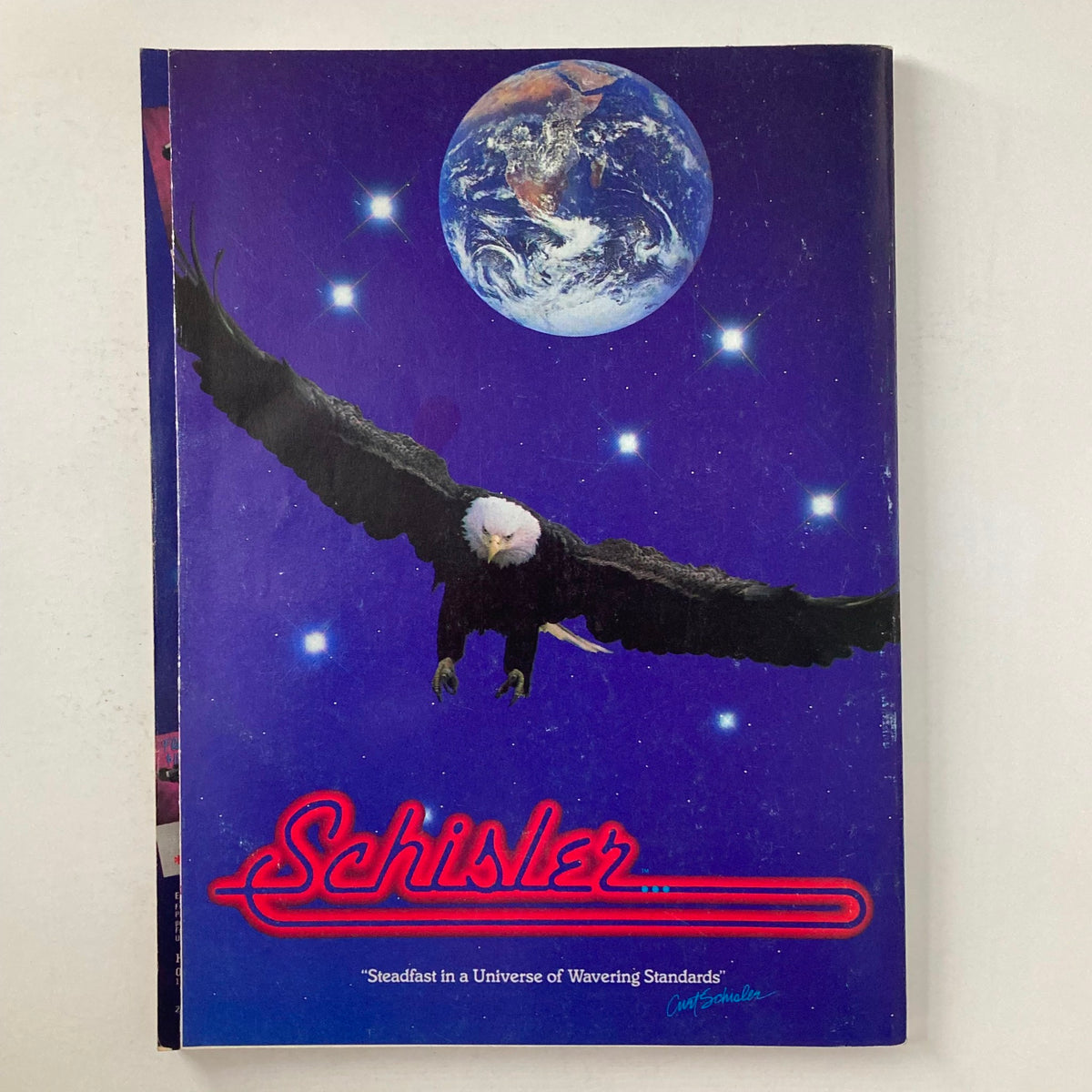 Back cover of Joe Weider's Muscle & Fitness Magazine May 1988, displaying a striking design featuring an eagle and a view of Earth against a starry backdrop.