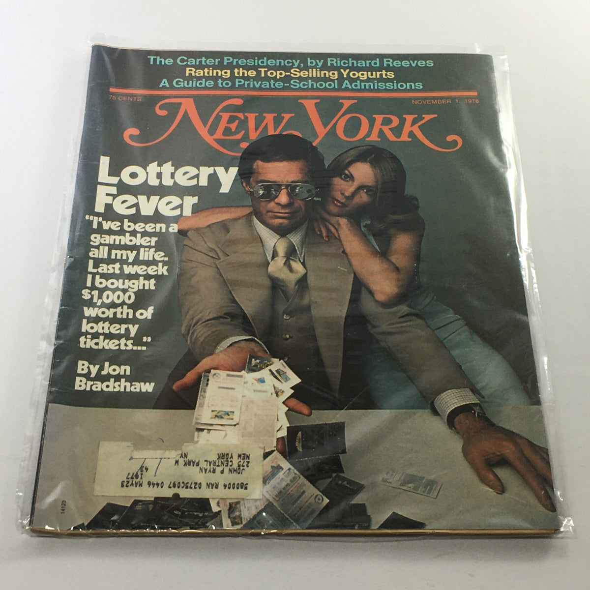 Cover of New York Magazine: November 1, 1976, featuring the article 'Lottery Fever' by Jon Bradshaw. The image shows a man in sunglasses and suit holding lottery tickets while a woman poses beside him. The magazine showcases vintage design elements and includes promotional content in the background.