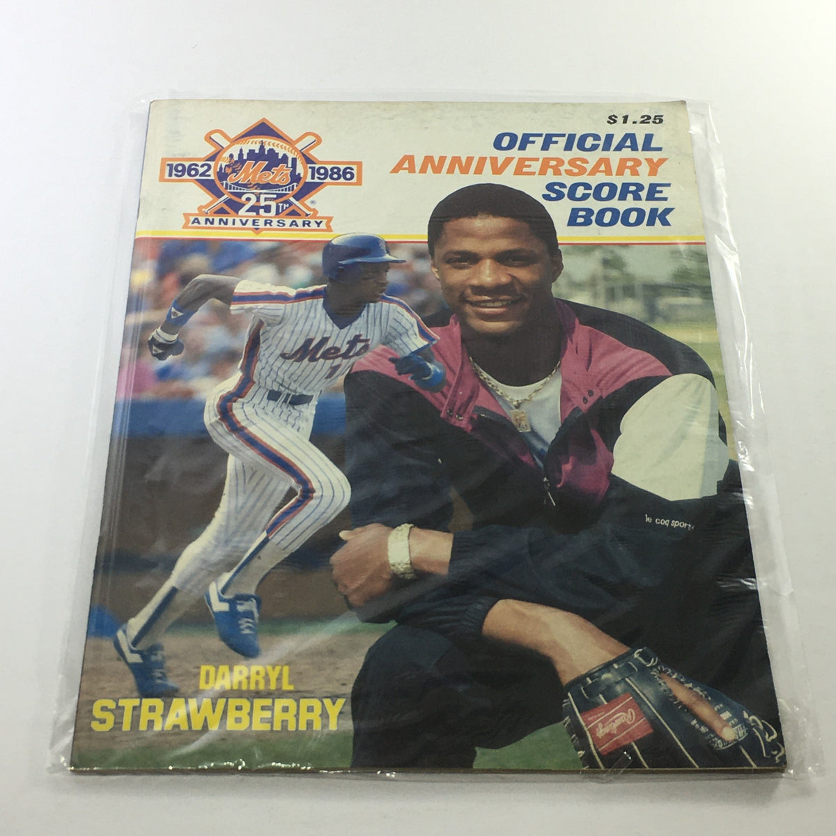 1962-1986 New York Mets Official Score Book 25th Anniversary featuring Darryl Strawberry, showcasing the scorebook cover with vibrant colors and the iconic player smiling.