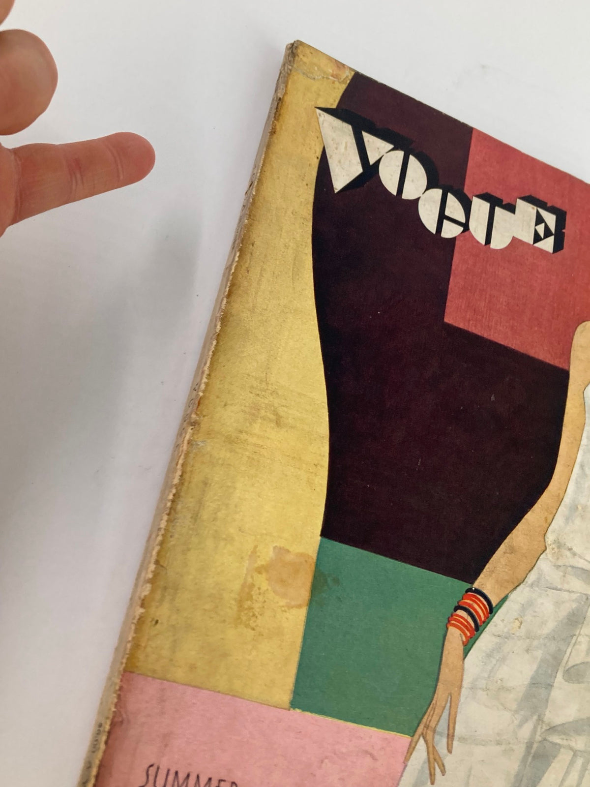 Cover of VTG Vogue Magazine June 8 1929 featuring vibrant colors and a stylish illustration of a woman in a white dress with bracelets, representing summer fashion.