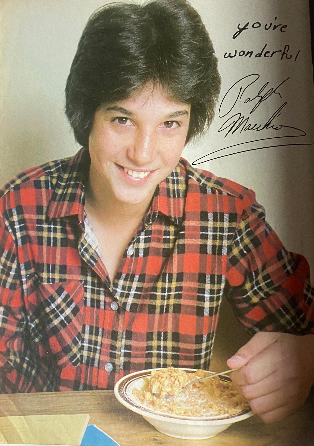 Image of Ralph Macchio from Tiger Beat Magazine, October 1981, smiling while enjoying breakfast, accompanied by a handwritten note, showcasing the charm of 80s teen idols.
