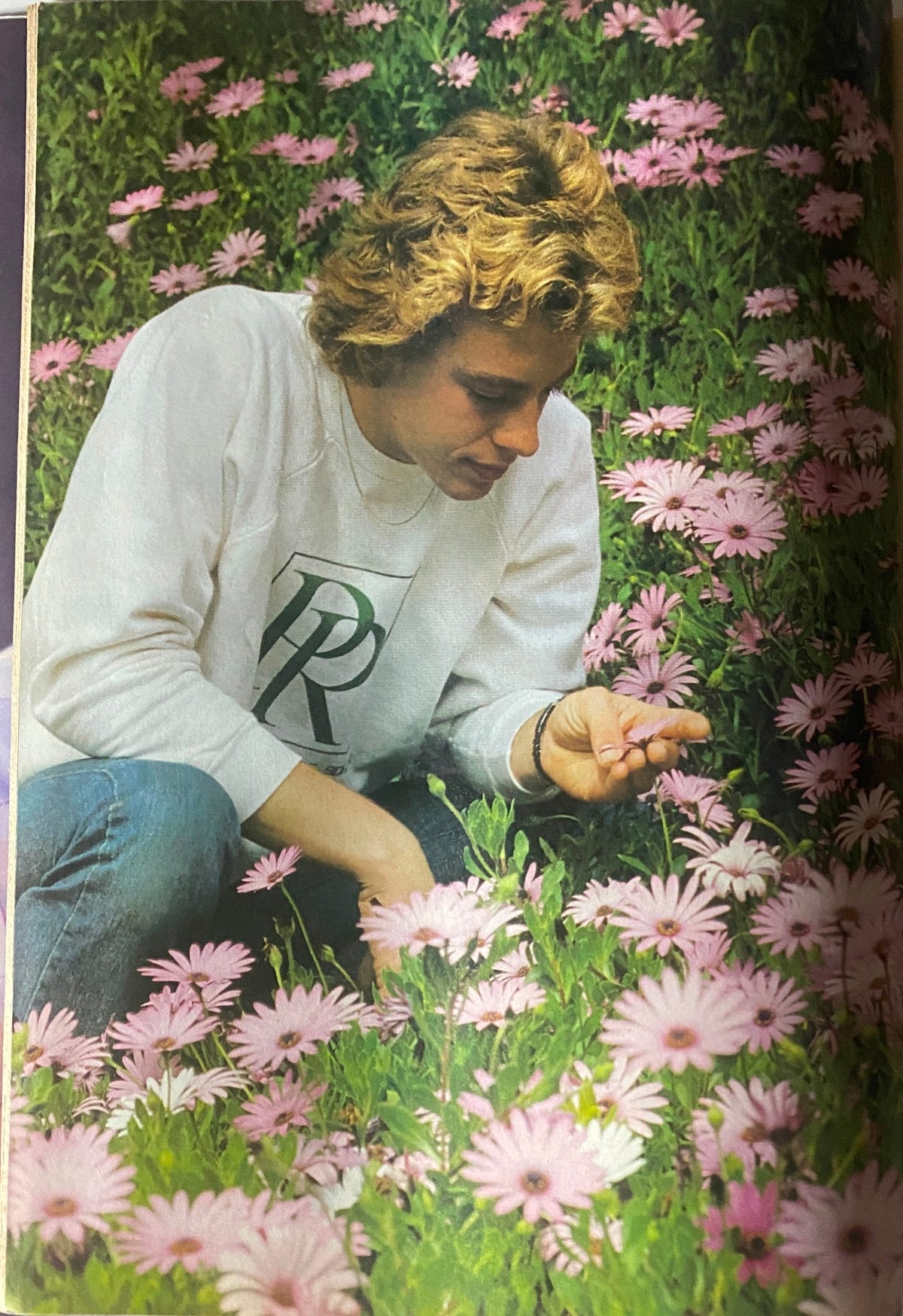 Tiger Beat Magazine August 1981 shows a candid shot of a young man examining flowers in a vibrant outdoor scene, embodying the carefree spirit of the 1980s.
