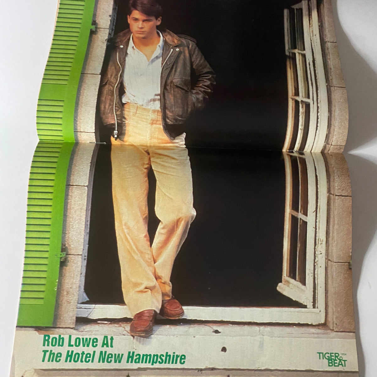 Poster of Rob Lowe from Tiger Beat Magazine February 1984, showcasing his fashion style for the movie Hotel New Hampshire and celebrating 1980s pop culture.