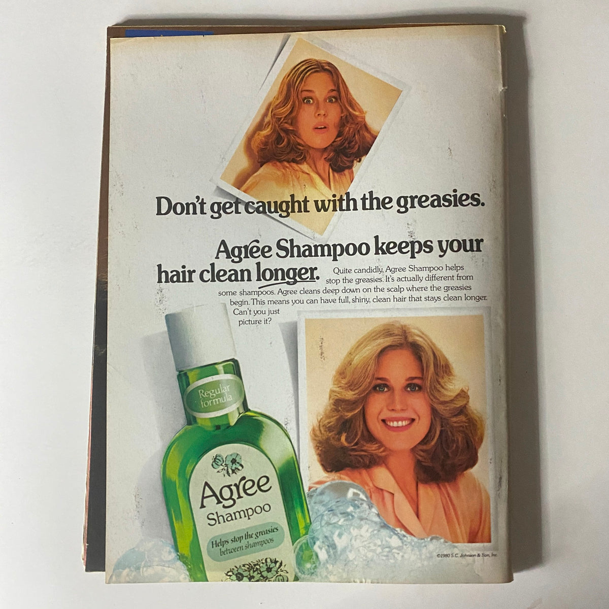 Advertisement for Agree Shampoo from Tiger Beat Magazine October 1980, showcasing the product's benefits with a smiling model and appealing visuals.