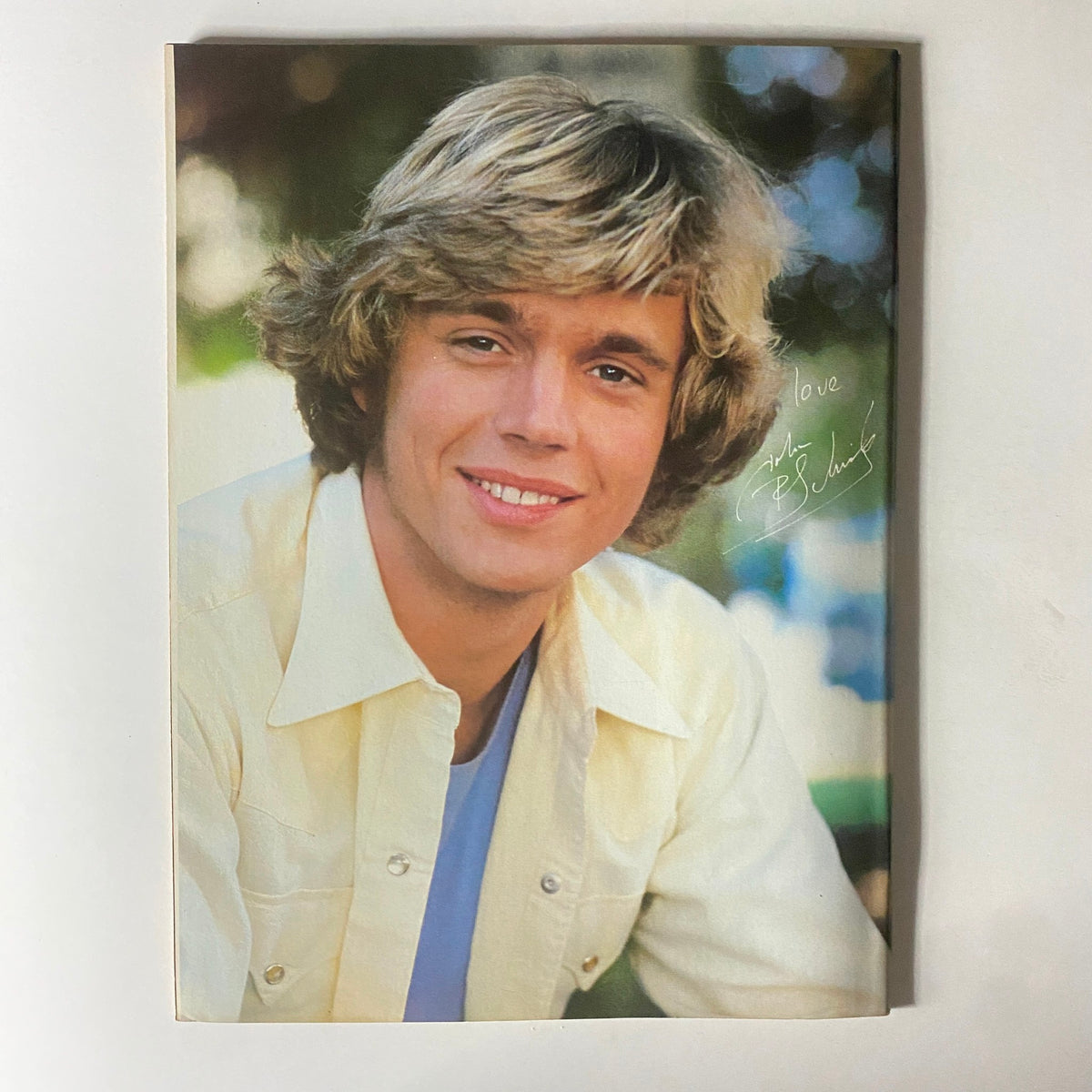 John Schneider featured in Tiger Beat Star Super Special April 1981, presenting a warm smile in a light-colored shirt, embodying 1980s pop culture.