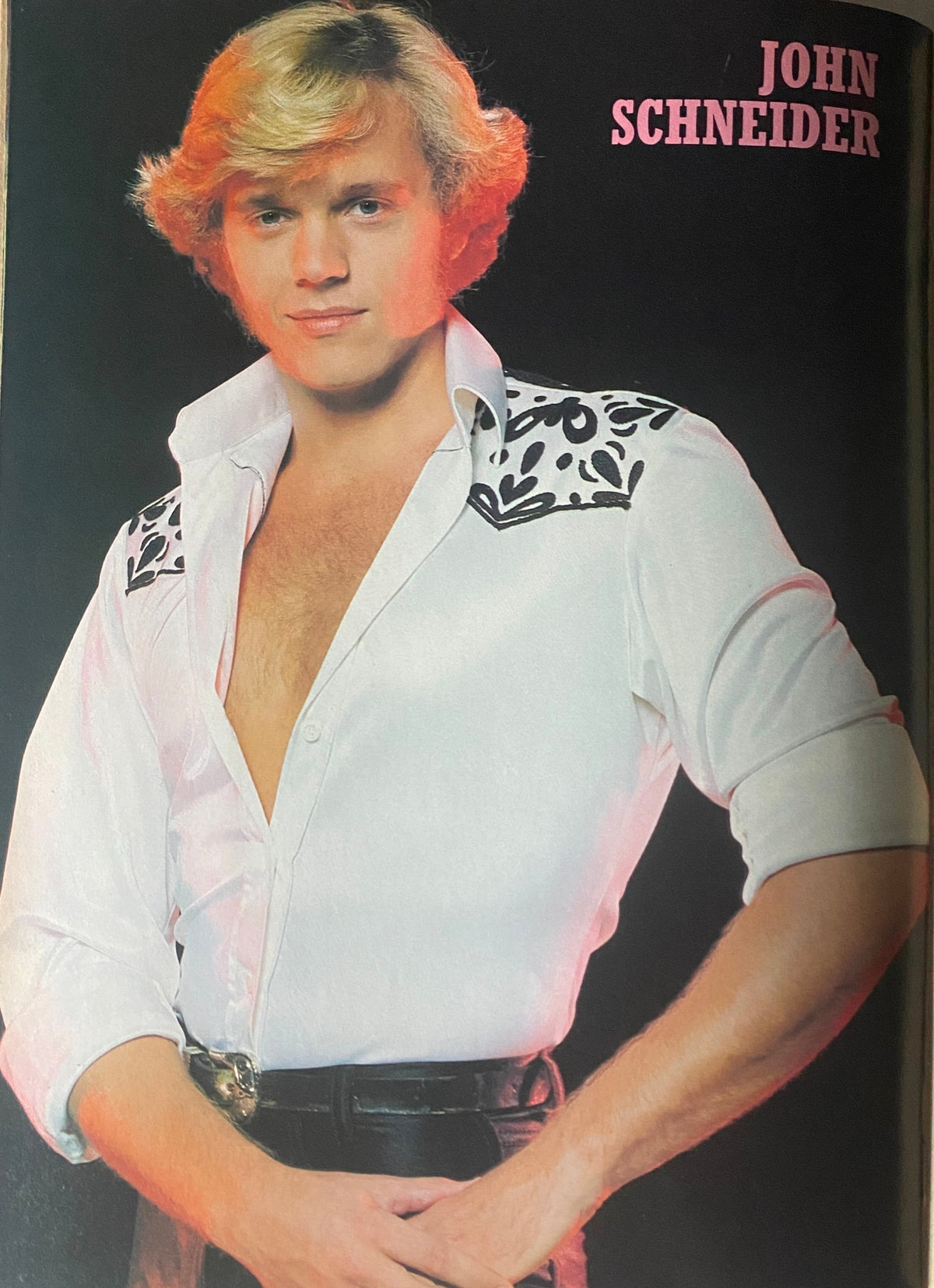 John Schneider featured in Tiger Beat Star Magazine August 1981, showcasing a stylish photo with a vibrant early '80s fashion aesthetic.
