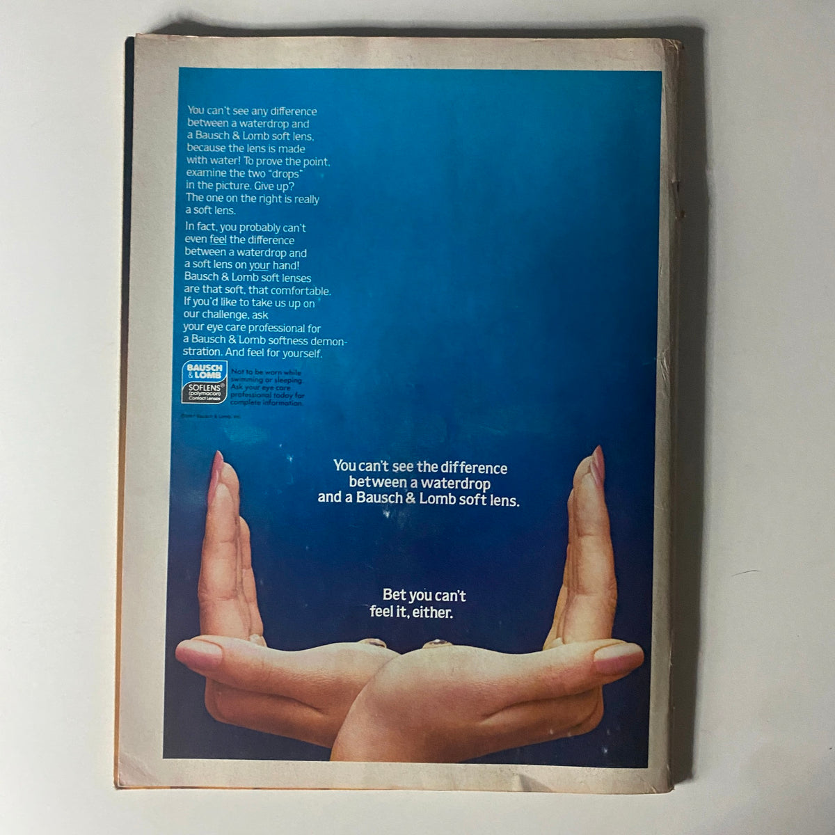Bausch & Lomb advertisement from the back of Tiger Beat Star Magazine August 1981, featuring a blue background and hands illustrating lens comfort.