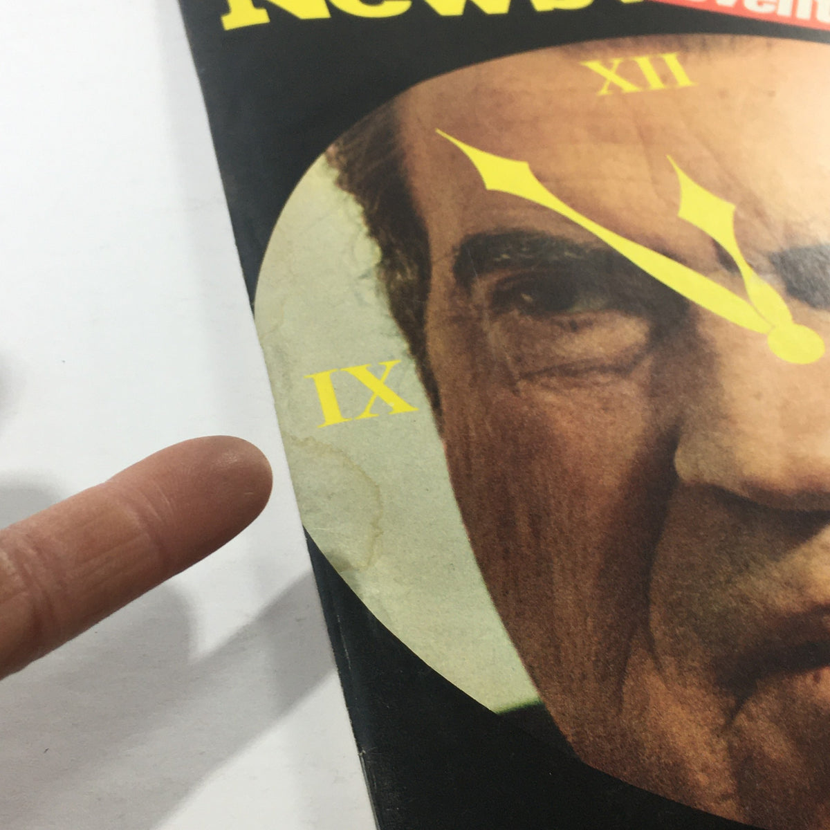 Close-up of the Newsweek Magazine cover dated August 12, 1974, highlighting Richard Nixon's face and the clock design with the title 'The Eleventh Hour.' The image shows marks of age and previous ownership.