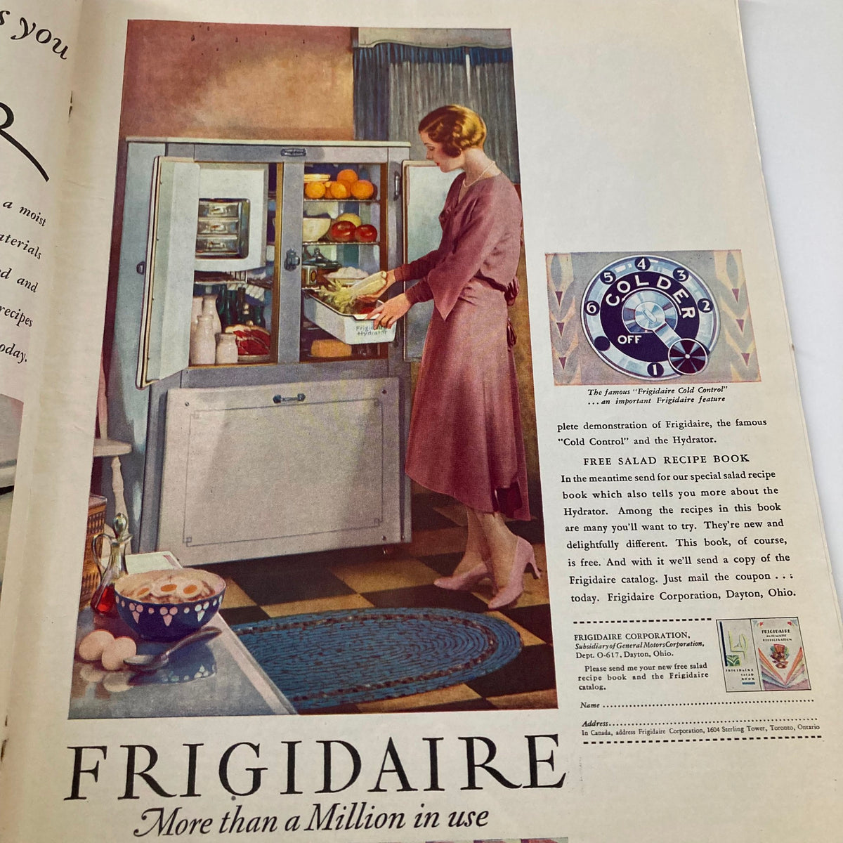 VTG Collier's Magazine February 8 1930 advertisement for Frigidaire, illustrating a woman using the refrigerator with fresh produce inside, emphasizing modern kitchen appliances.