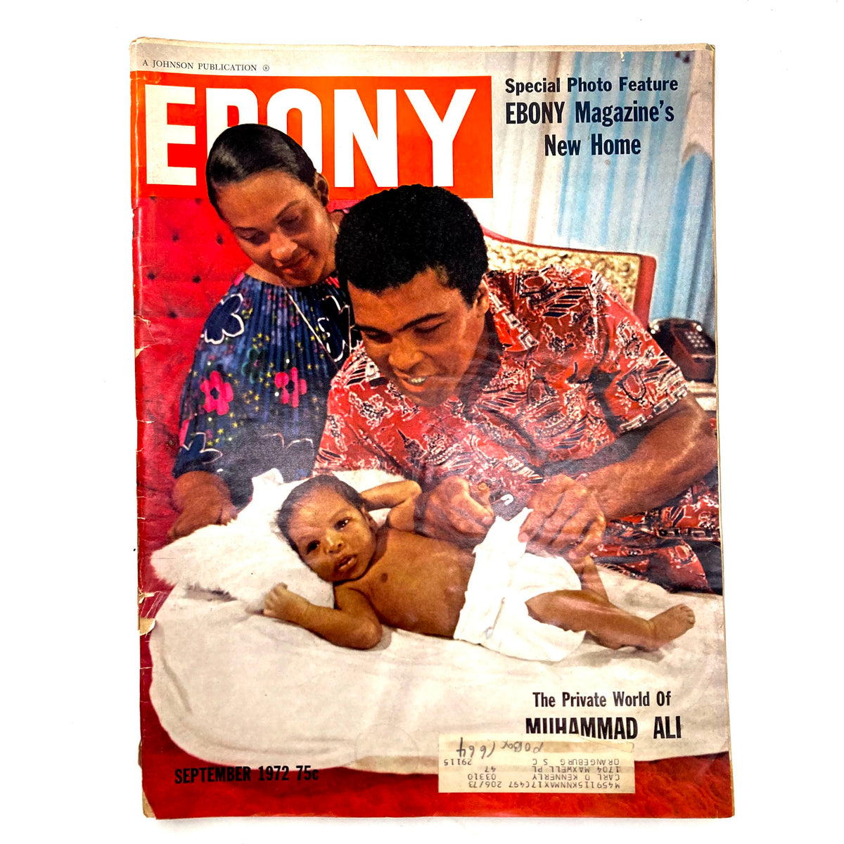 Cover of VTG Ebony Magazine September 1972 featuring Muhammad Ali with a baby, titled 'The Private World of Muhammad Ali'. It showcases a vibrant red background with Ali in a colorful shirt.