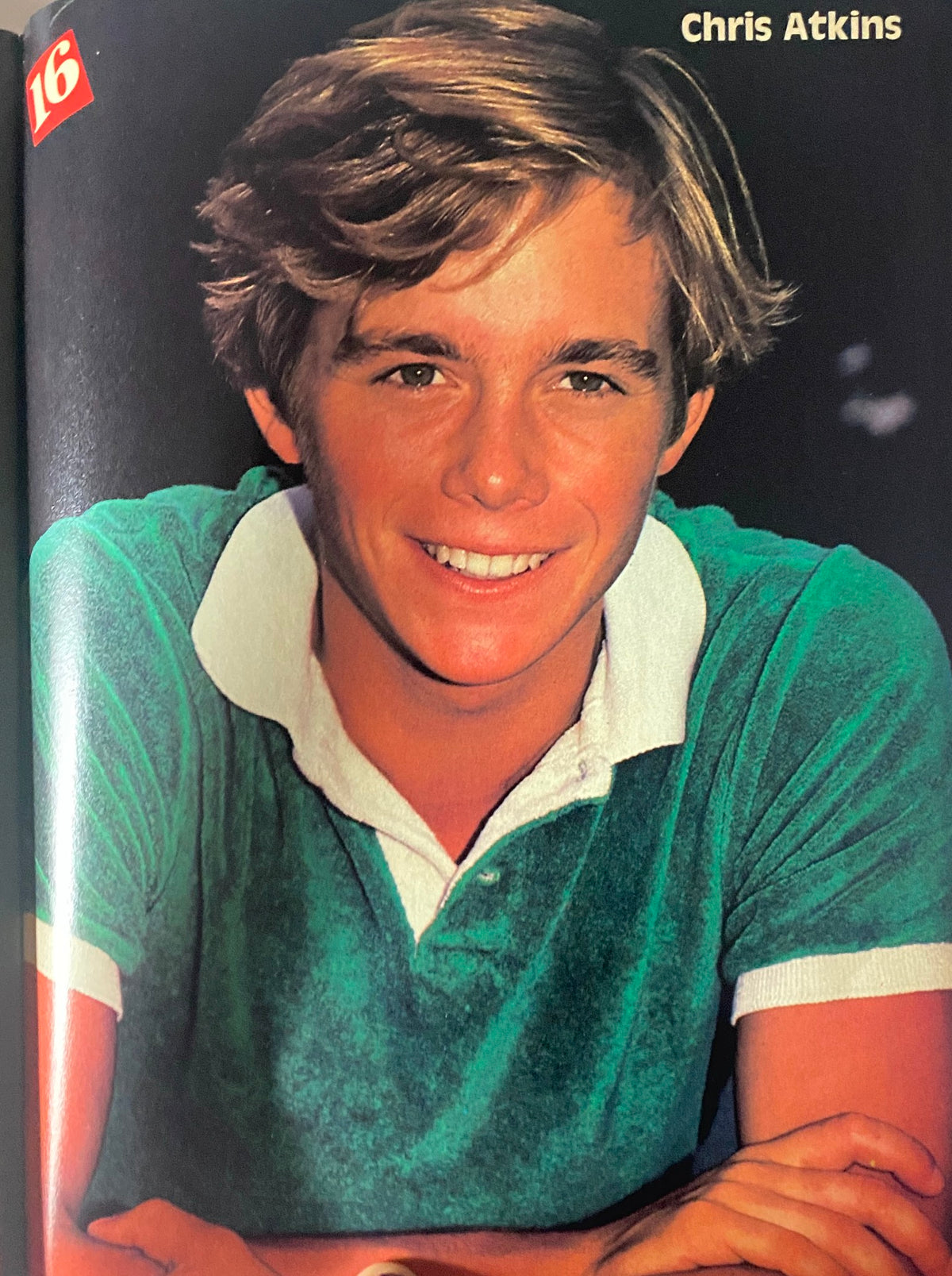 16 Magazine November 1982 - Smiling portrait of Chris Atkins, a popular actor of the era, shown in a vibrant green polo shirt.