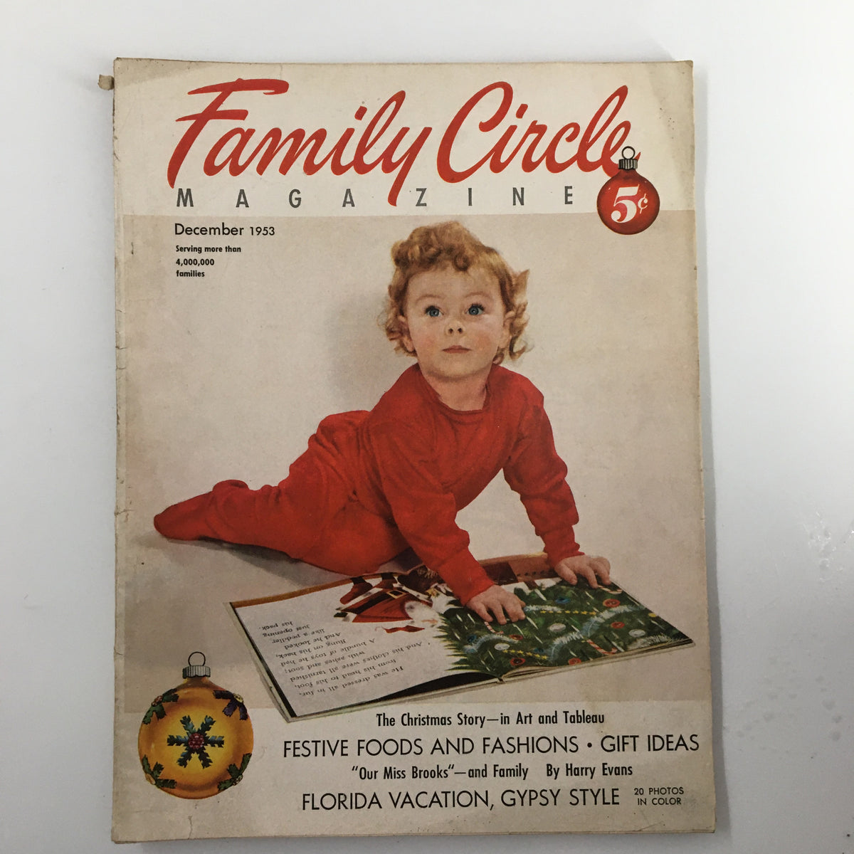 Cover of Vintage Family Circle Magazine December 1953 featuring a child in red, showcasing festive themes and Florida vacation content.