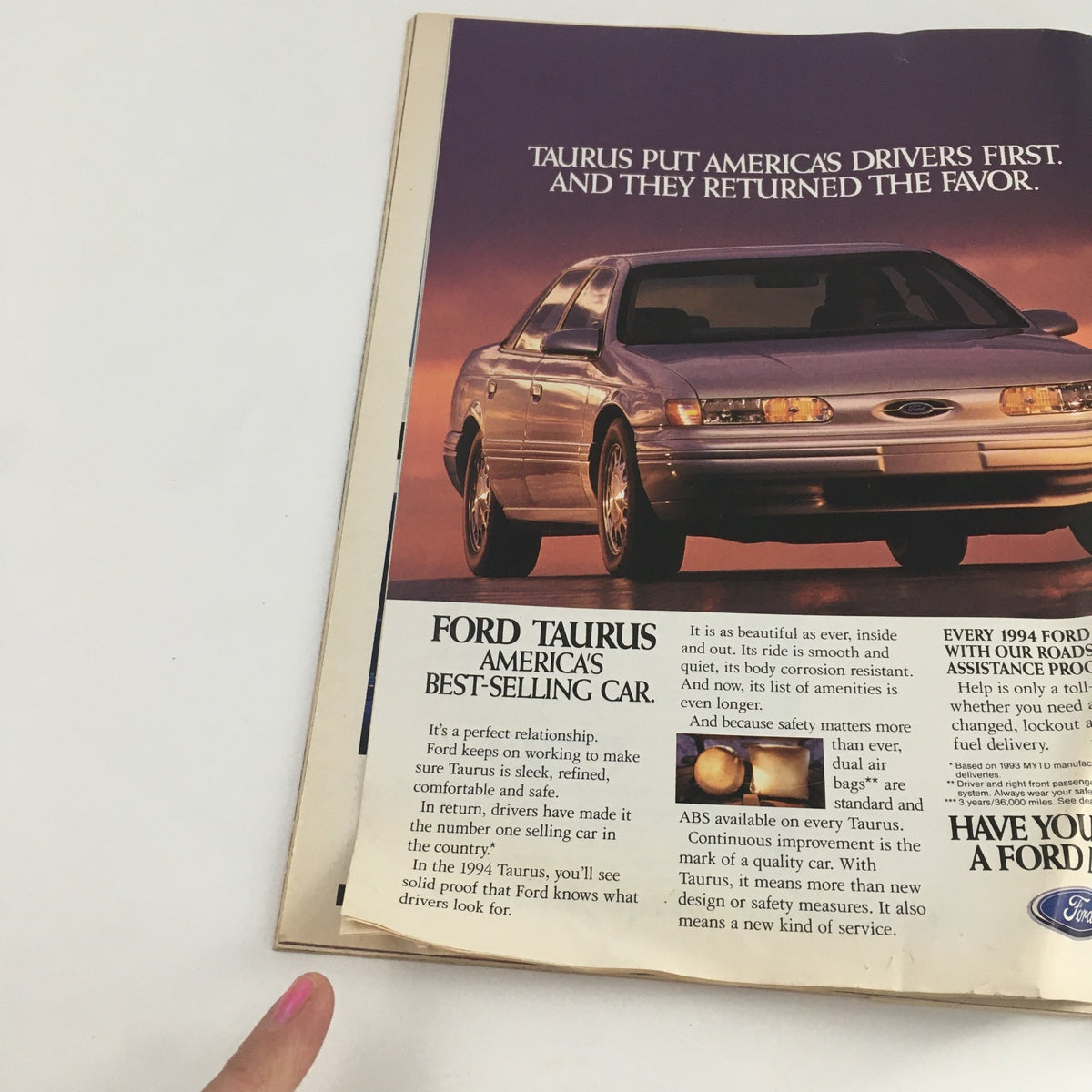 Ford Taurus advertisement from Time Magazine February 21 1994 showcasing America's best-selling car. The ad highlights the sleek design and features of the 1994 Taurus, emphasizing its safety and comfort.