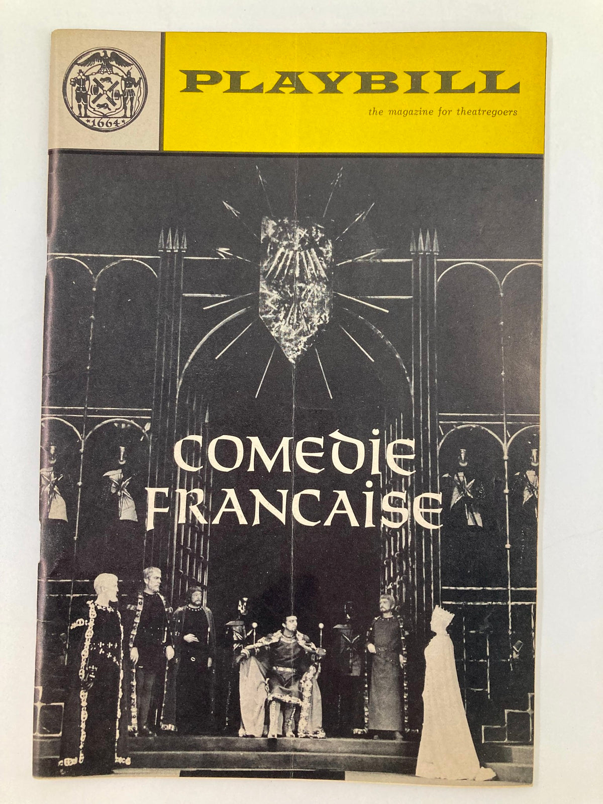 1966 Playbill for The Comedie Francaise at New York City Center, featuring a black and white staged performance with dramatic lighting and characters in elaborate costumes.