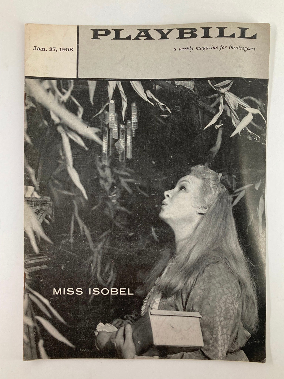 1958 Playbill for 'Miss Isobel' featuring a vintage cover image from Royale Theatre, showcasing a woman gazing upwards amidst an artistic backdrop.