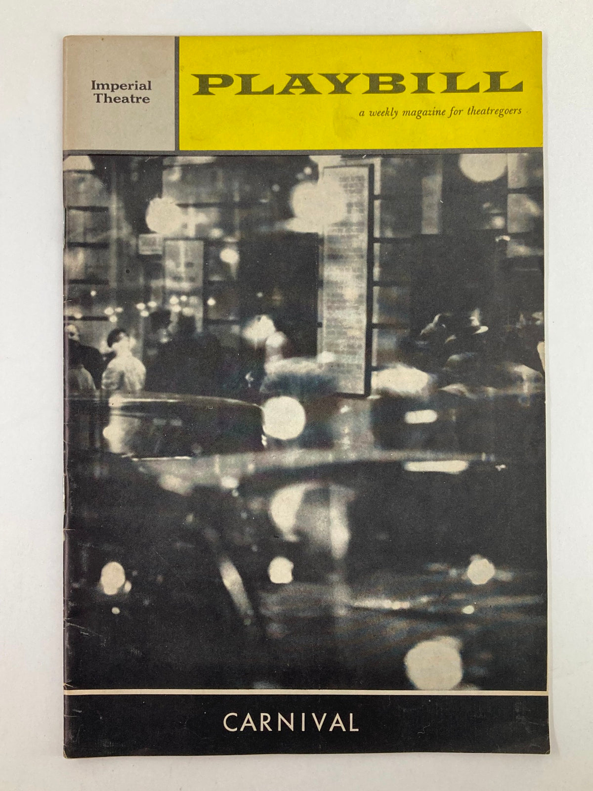 Vintage 1962 Playbill from the Imperial Theatre featuring the musical Carnival, with a focus on atmospheric photography and nostalgic design.
