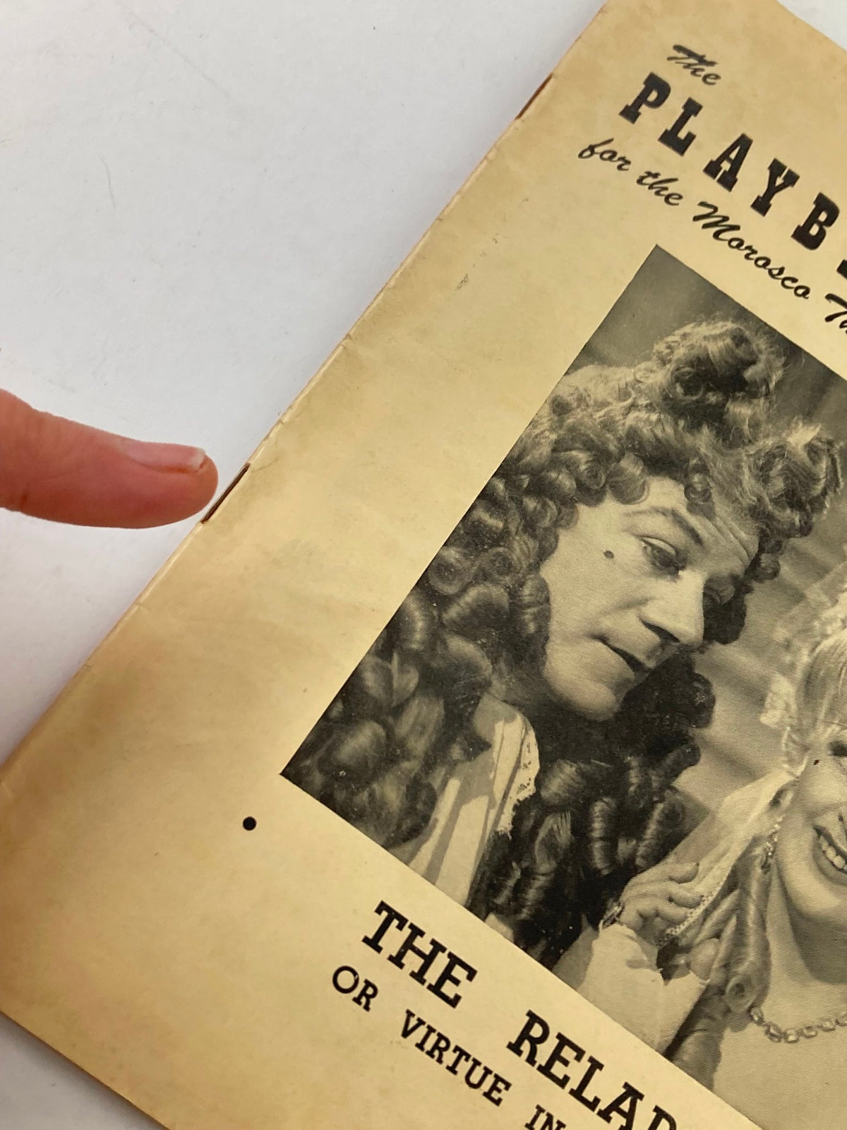 Close-up view of the 1950 Playbill Morosco Theatre highlighting Cyril Ritchard and Madge Elliott in The Relapse, showing detail of the cover and soft wear marks.