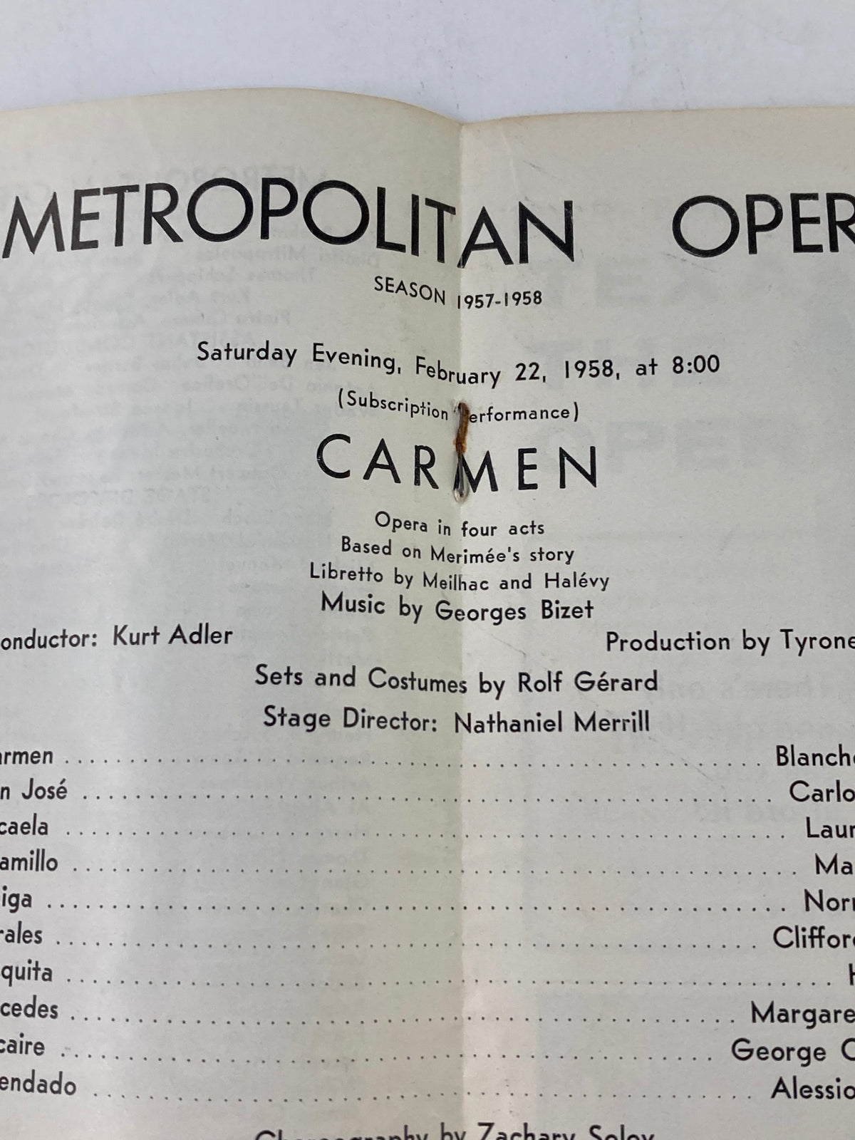 Close-up view of the 1958 Metropolitan Opera Program for Carmen, showing conductor details and the production credits, highlighting its historical significance.