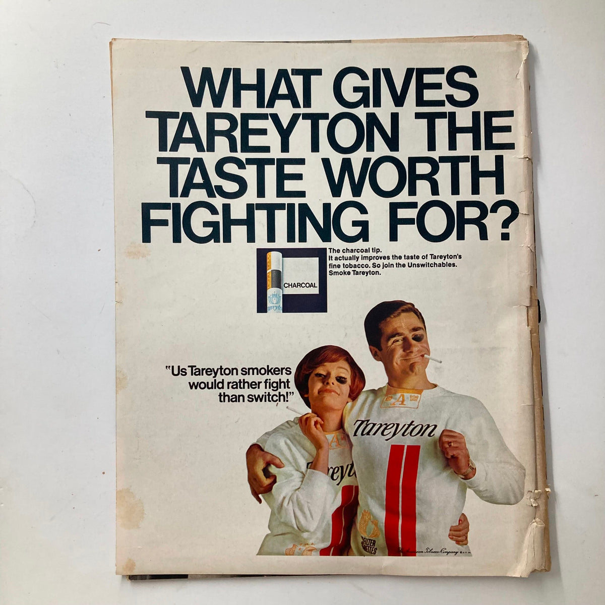 Back cover of VTG Look Magazine April 4 1967 featuring a vintage advertisement for Tareyton cigarettes with models promoting the product and the slogan 'What gives Tareyton the taste worth fighting for?'.