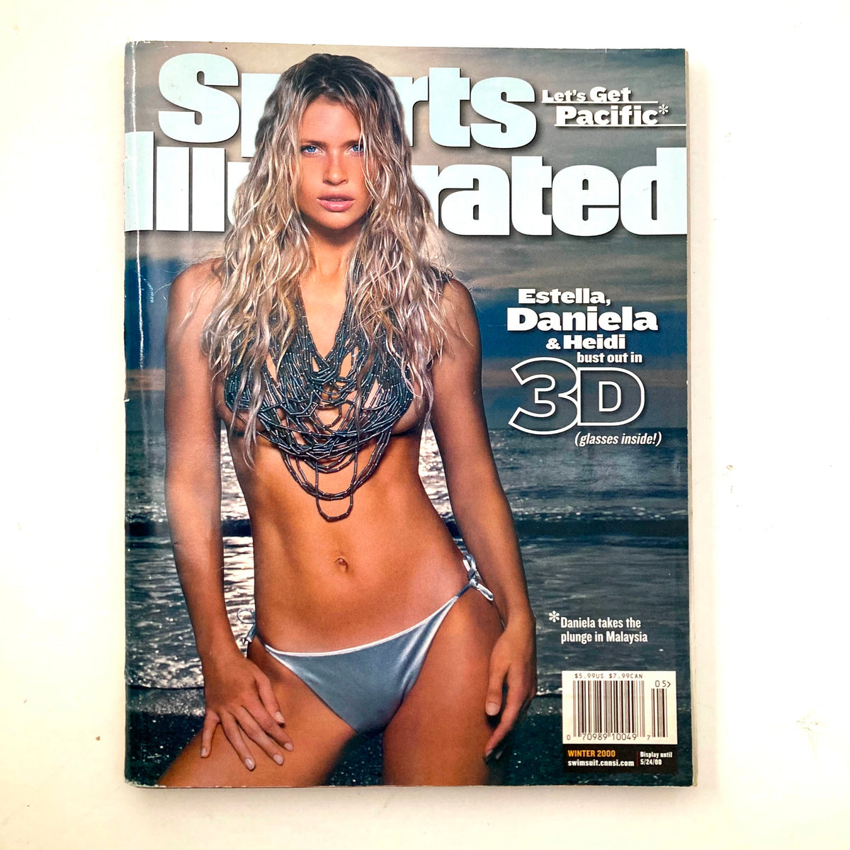 Cover of Sports Illustrated Magazine Winter 2000 featuring models Estella Warren, Daniela Pestova, and Heidi Klum, showcasing early 2000s fashion.
