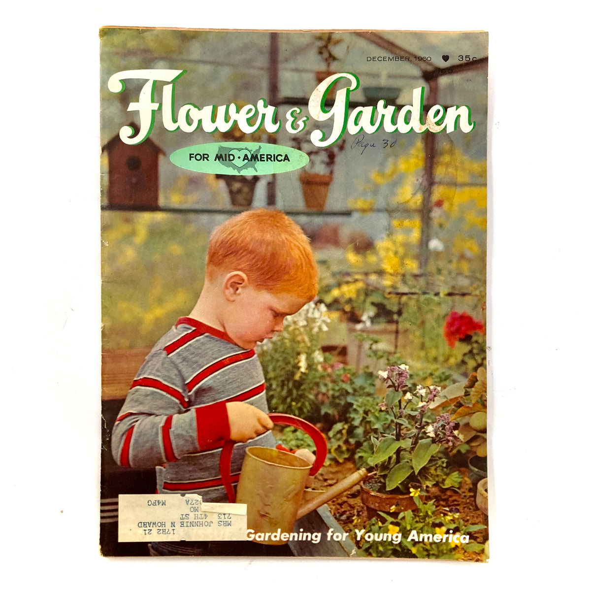 Cover of Flower & Garden Magazine for Mid-America December 1960 featuring a young boy watering plants, showcasing gardening for young America.