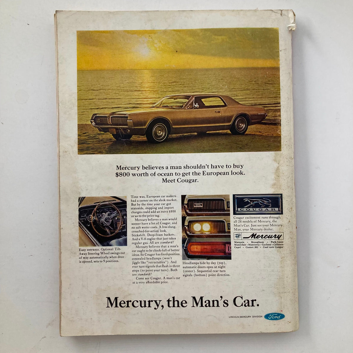 Back cover of Playboy Magazine December 1966, featuring an advertisement for Mercury Cougar car with a scenic ocean view, emphasizing the luxury and style of the era.