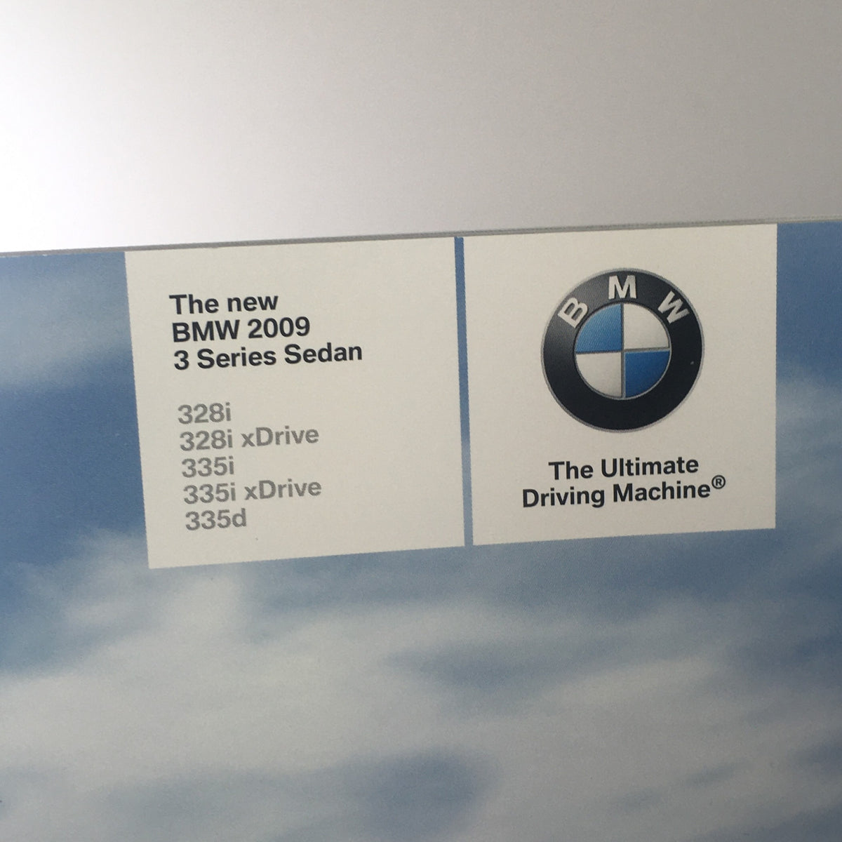 2009 BMW 3 Series Sedan brochure detail displaying the model information for 328i, 328i xDrive, 335i, and 335d.