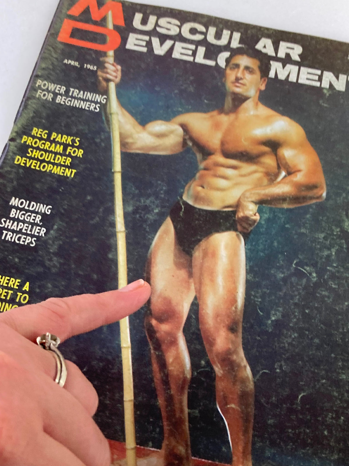 Cover of VTG Muscular Development Magazine April 1965 Vol 2 #4 featuring a muscular male model demonstrating bodybuilding techniques, with the text highlighting power training and shoulder development.
