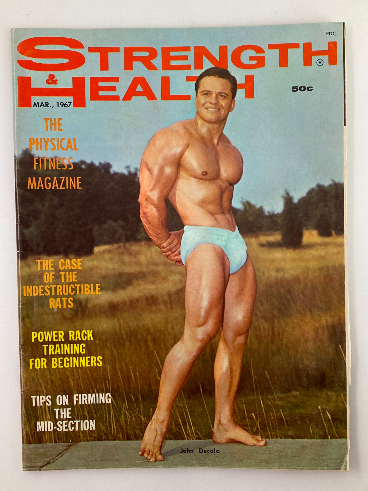Cover of VTG Strength & Health Magazine March 1967 featuring John Decola, showcasing bodybuilding and fitness themes from the 1960s.
