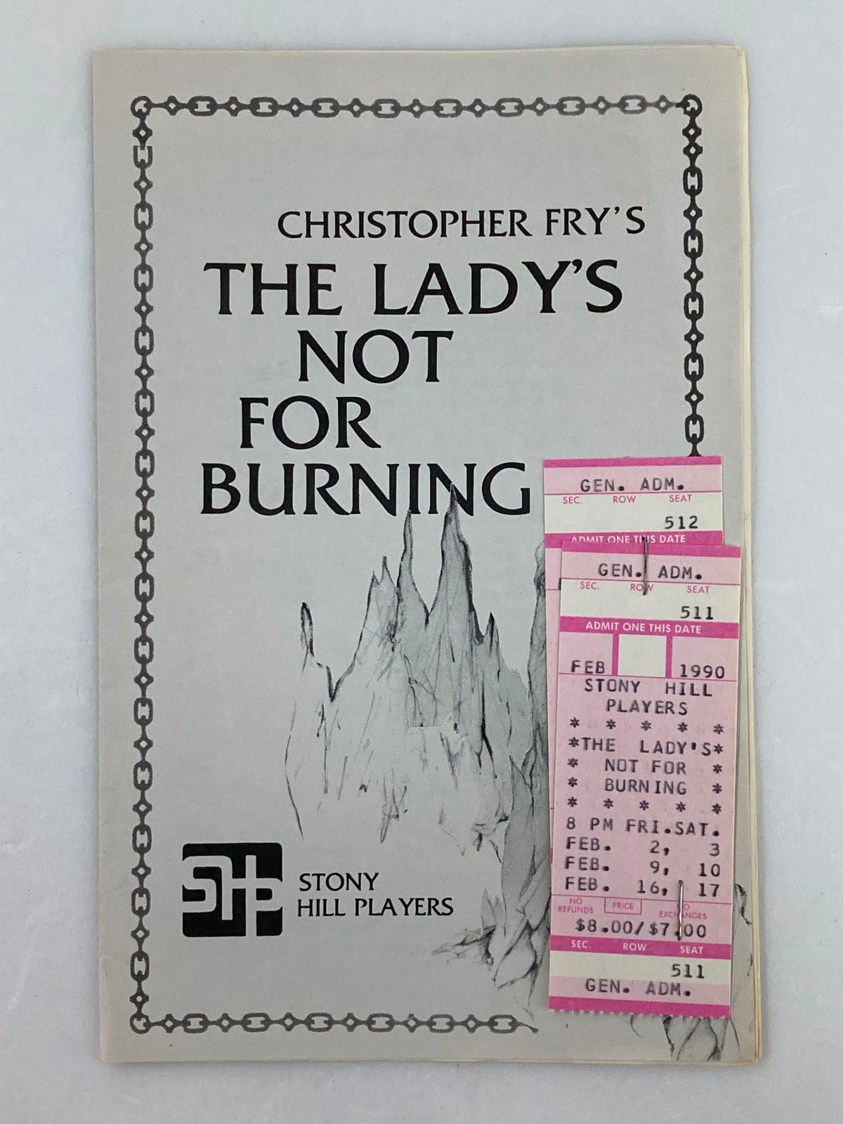 1990 Stony Hill Players Program for Christopher Fry's The Lady's Not For Burning, featuring a mountain illustration and attached ticket stubs.