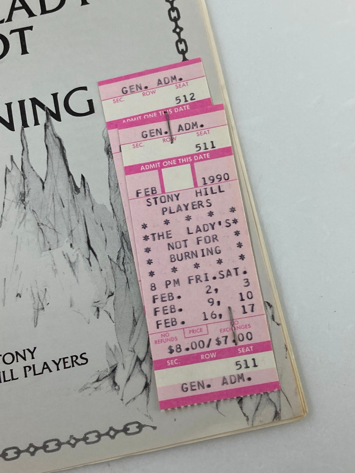 Ticket stubs for the play 'The Lady's Not For Burning' from the 1990 Stony Hill Players program, displaying seat information and performance dates.