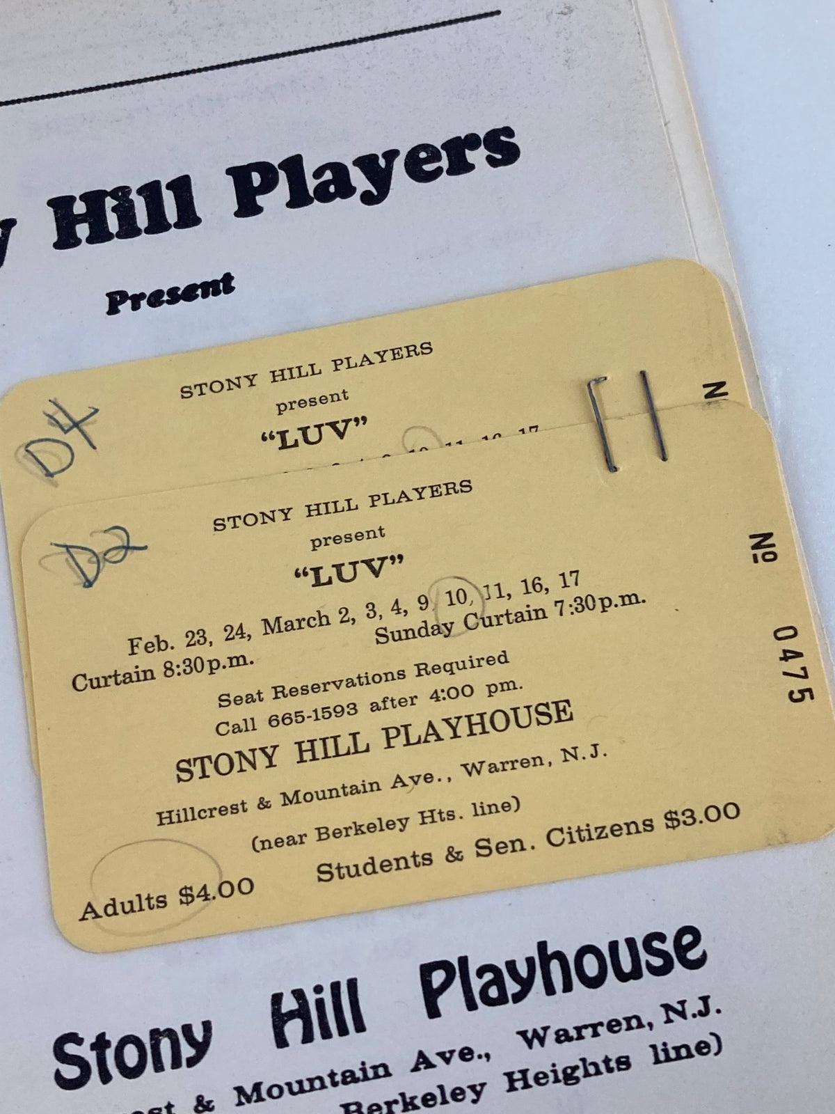 Close-up of tickets from the 1978-1979 Stony Hill Players Presents Doug Eaton in Luv by Murray Schisgal, highlighting performance dates and pricing information.
