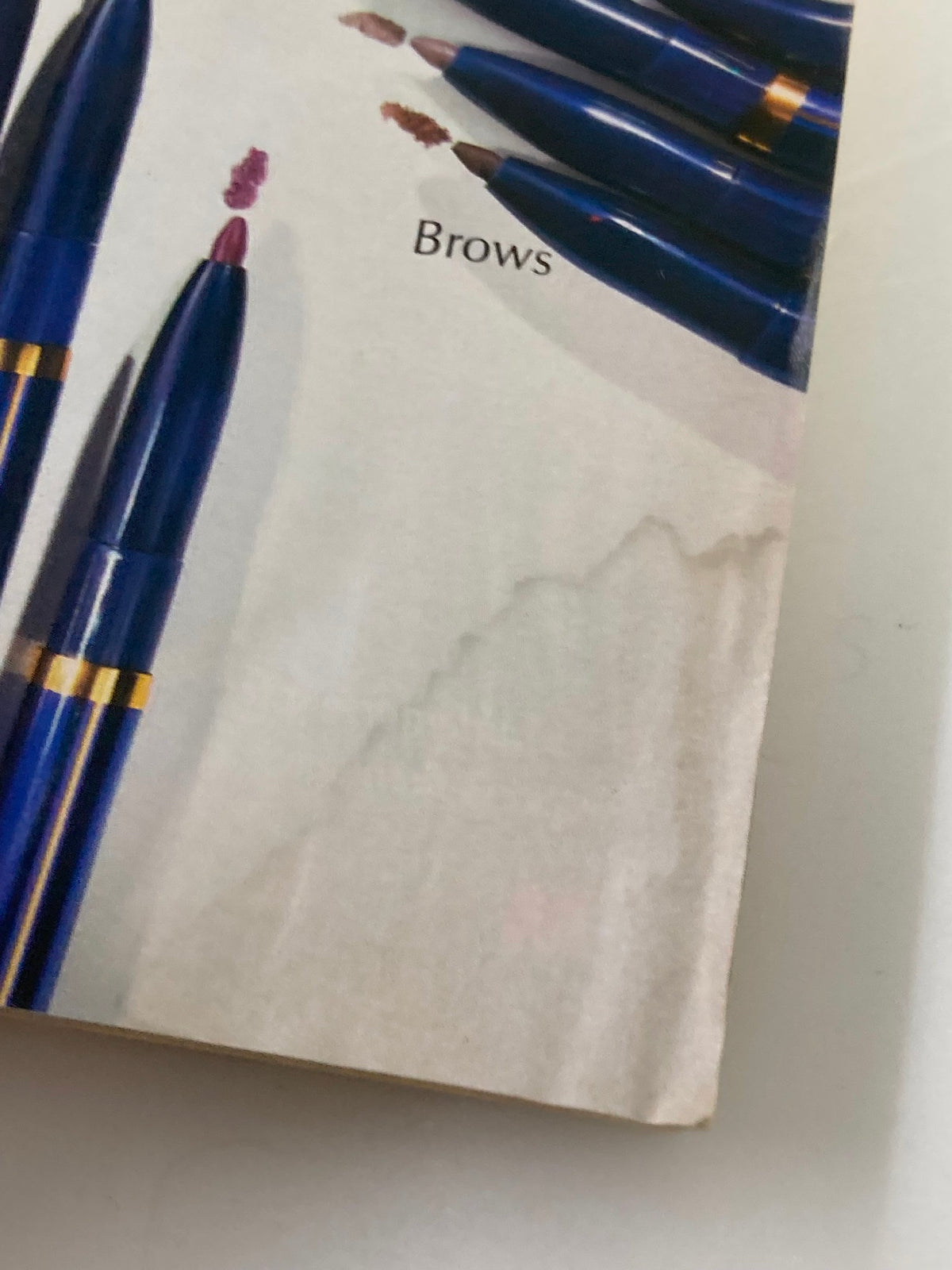 Image of the blue lip and brow pencils from the Cosmopolitan Magazine May 1990 featuring the iconic Madonna on the cover. The image shows various shades and mentions the word 'Brows'.
