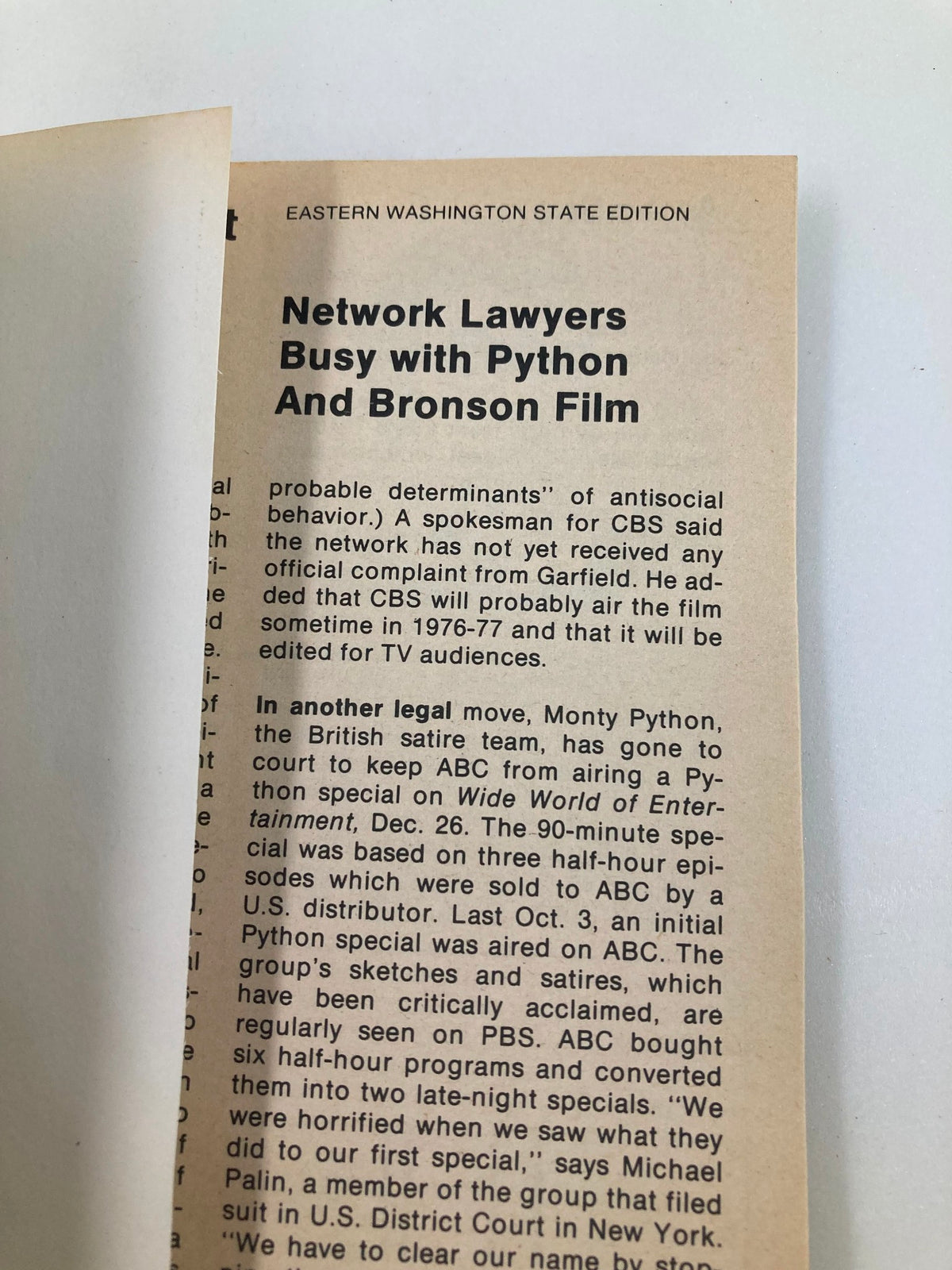 Inside page of TV Guide Magazine December 27 1975, discussing network lawyers busy with Monty Python and Bronson film, part of Eastern Washington State Edition.
