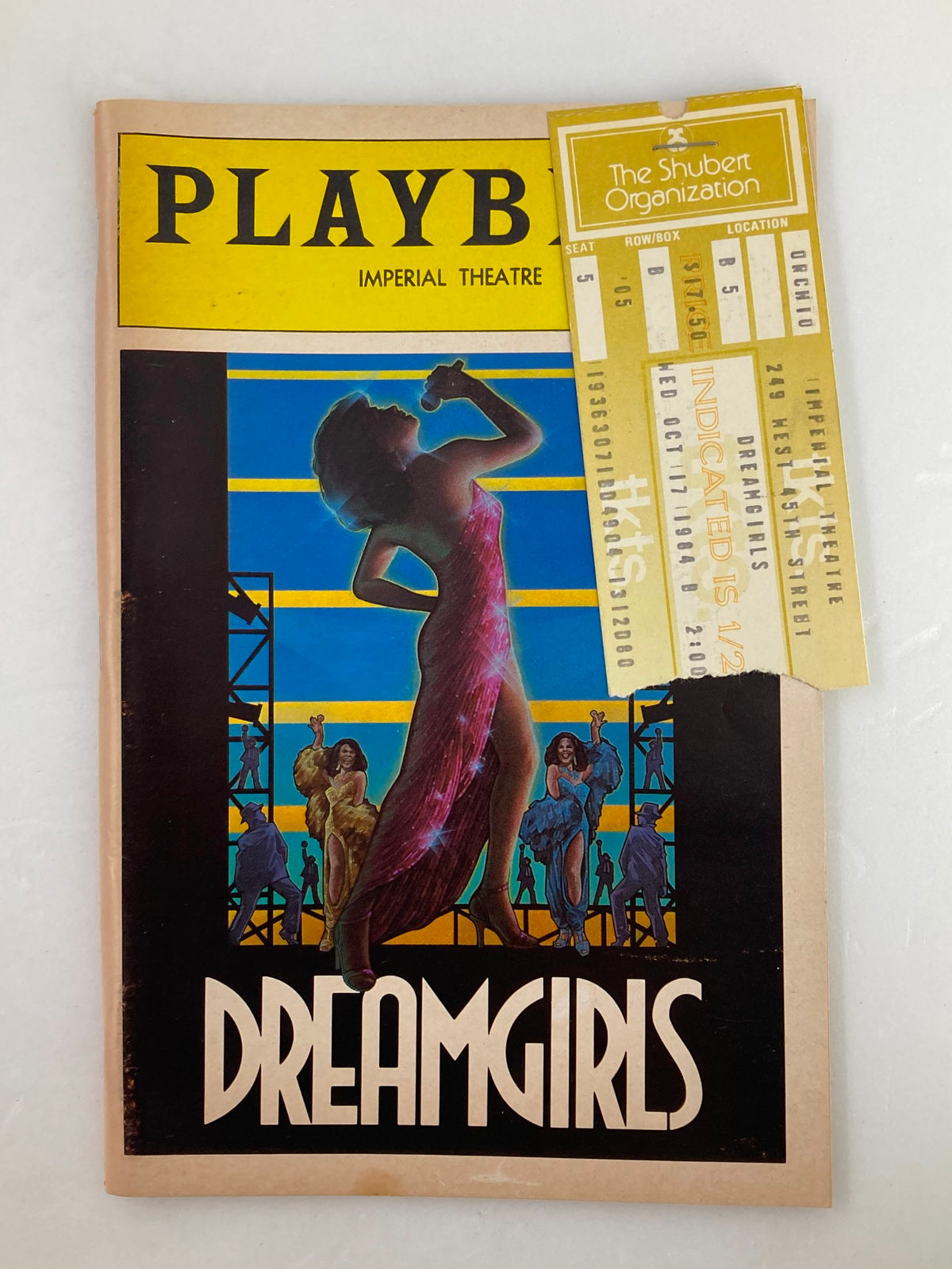 1984 Playbill for 'Dreamgirls' at the Imperial Theatre featuring a colorful cover art and attached ticket from The Shubert Organization.