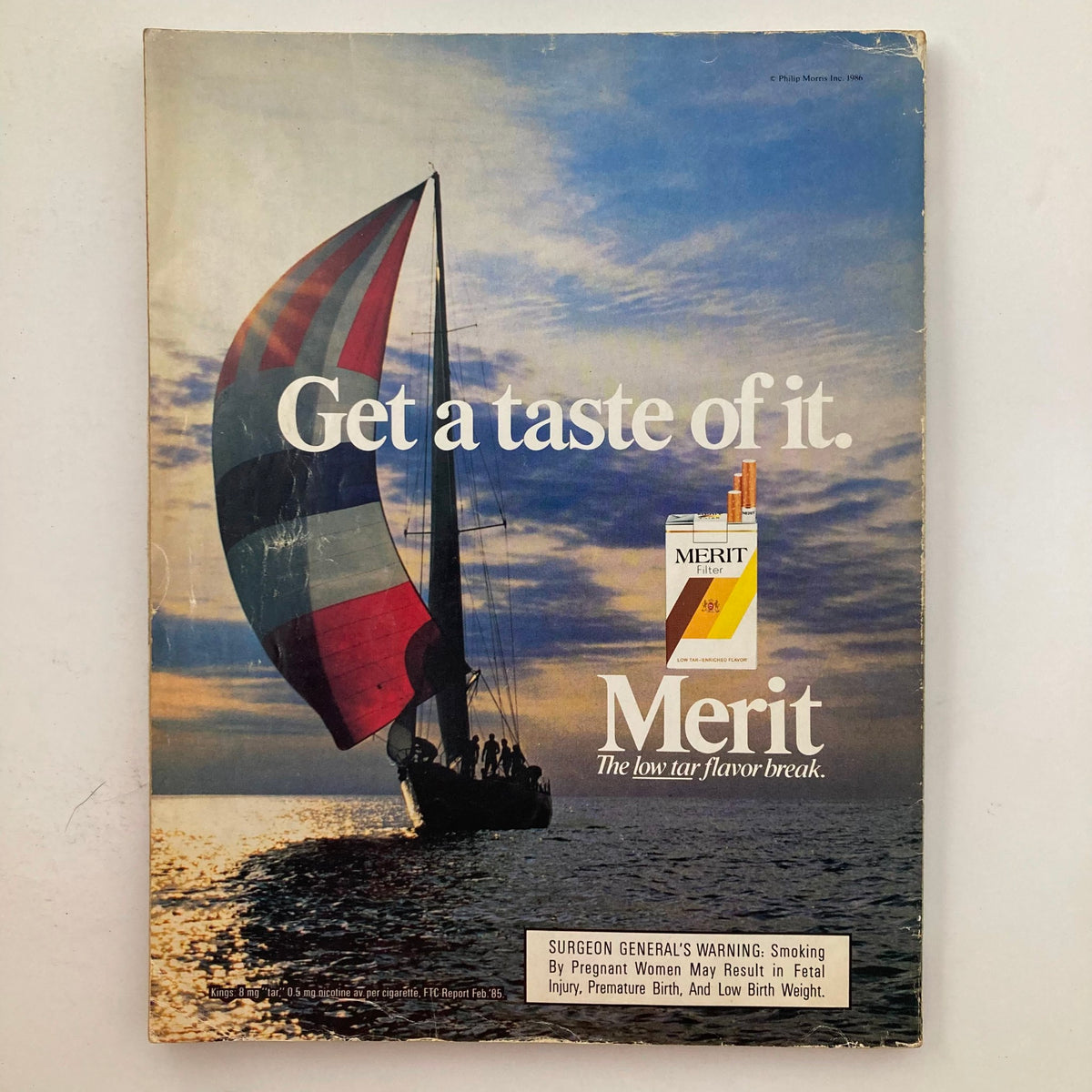 VTG Playboy Magazine May 1986 featuring Kathleen Turner on the cover with a vintage cigarette advertisement, showcasing a sailboat at sunset.