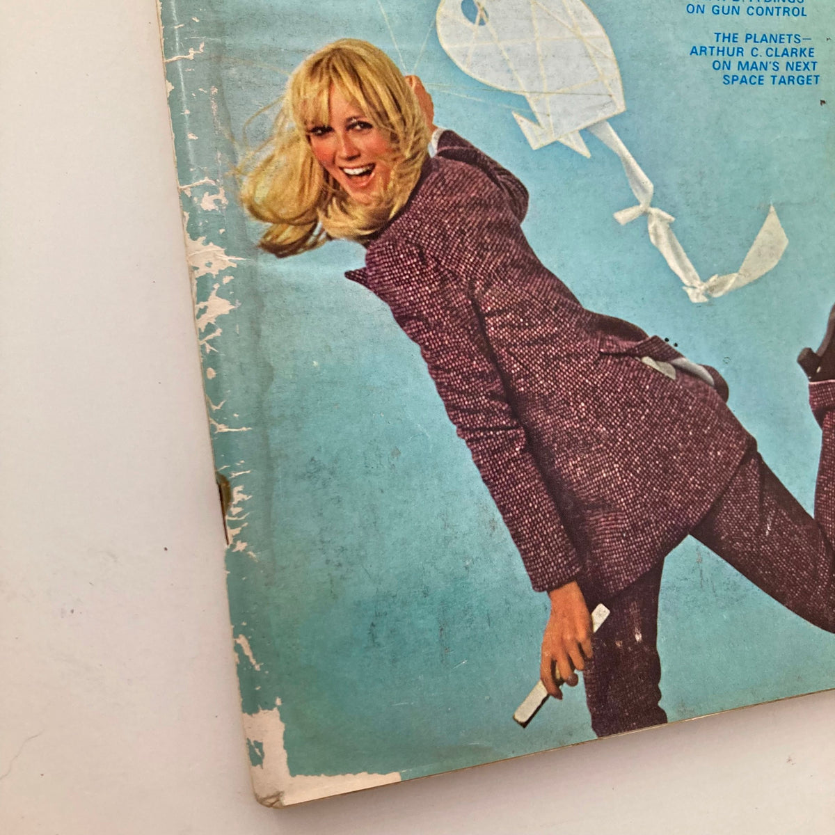 Close-up of the VTG Playboy Magazine March 1969 cover showcasing Playmate Kathy MacDonald with a playful smile against a blue backdrop.